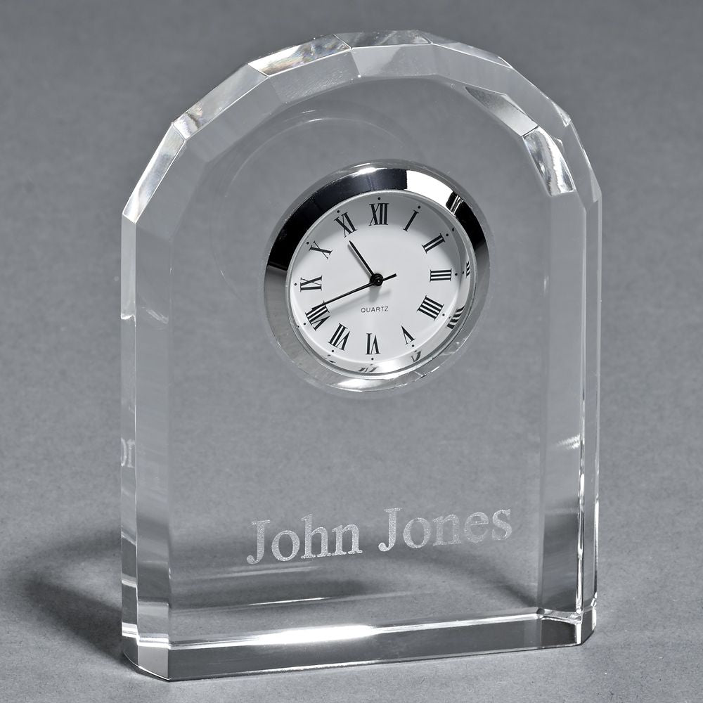 Elegant Optic Crystal Arched Clock with chrome bezel and Roman numerals.