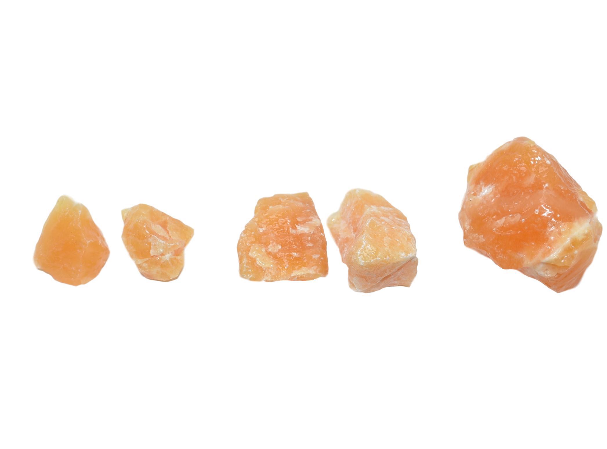 A collection of vibrant orange calcite chunks in various sizes, showcasing their natural beauty and unique textures.