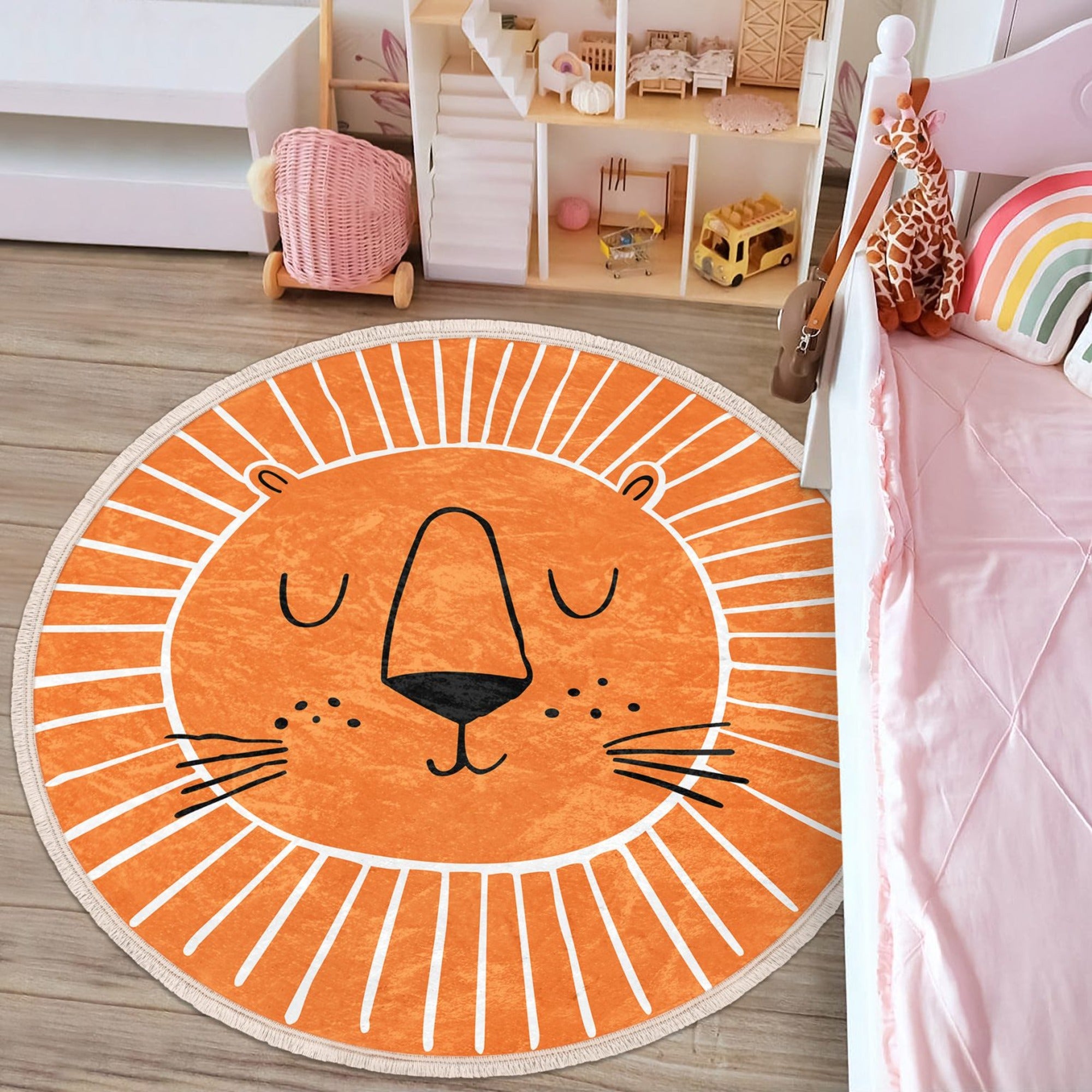 Orange round rug featuring a playful lion print, perfect for kids' rooms and nurseries.