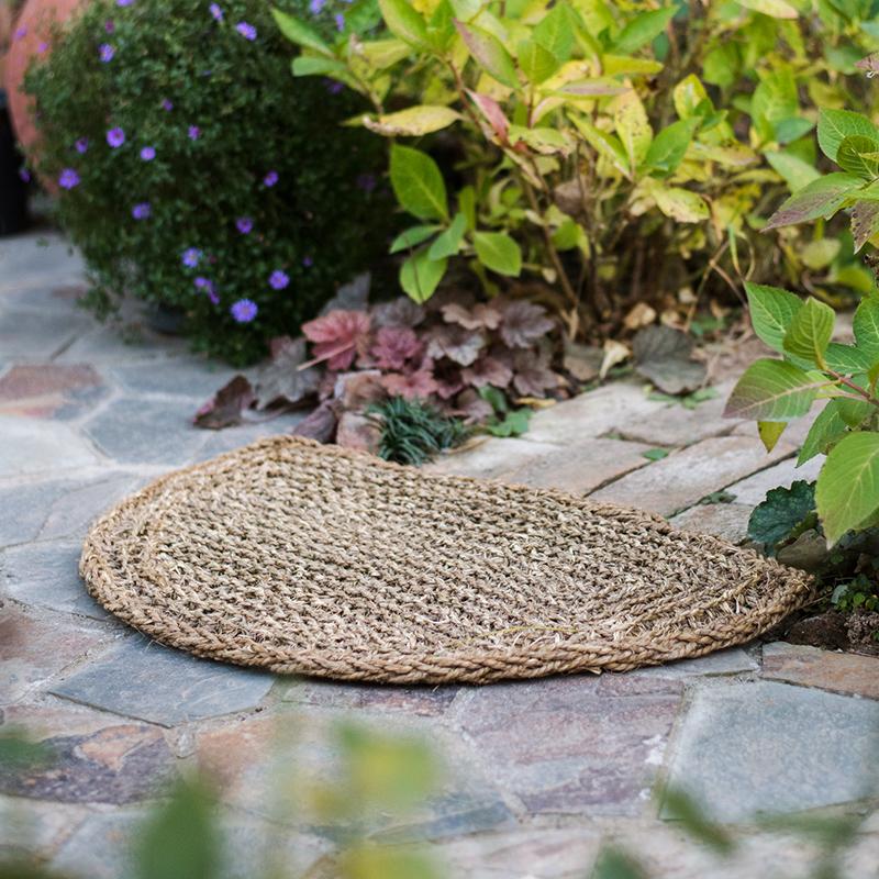 Organic Natural Straw Door Mat in khaki and brown colors, showcasing its rectangular and half round shapes.