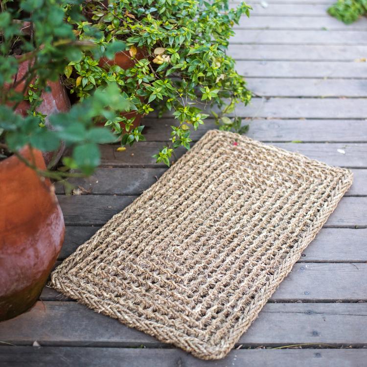 Organic Natural Straw Door Mat in khaki and brown colors, showcasing its rectangular and half round shapes.