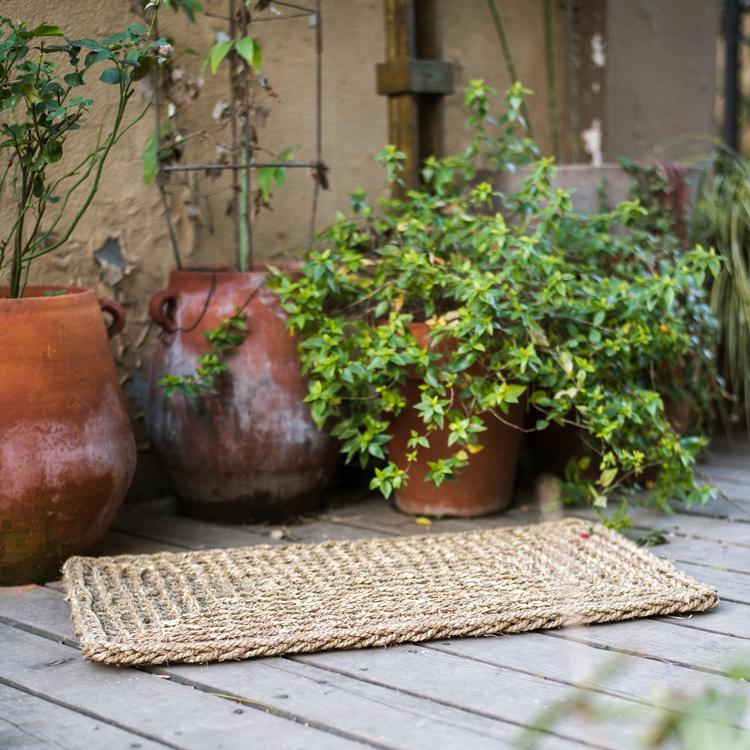 Organic Natural Straw Door Mat in khaki and brown colors, showcasing its rectangular and half round shapes.