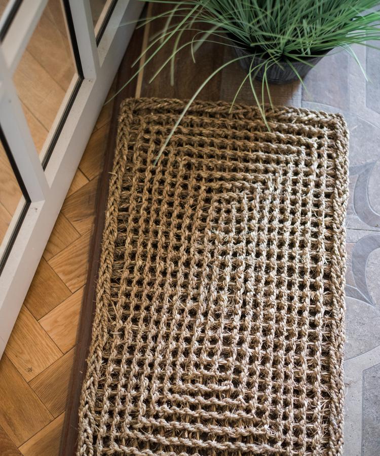 Organic Natural Straw Door Mat in khaki and brown colors, showcasing its rectangular and half round shapes.