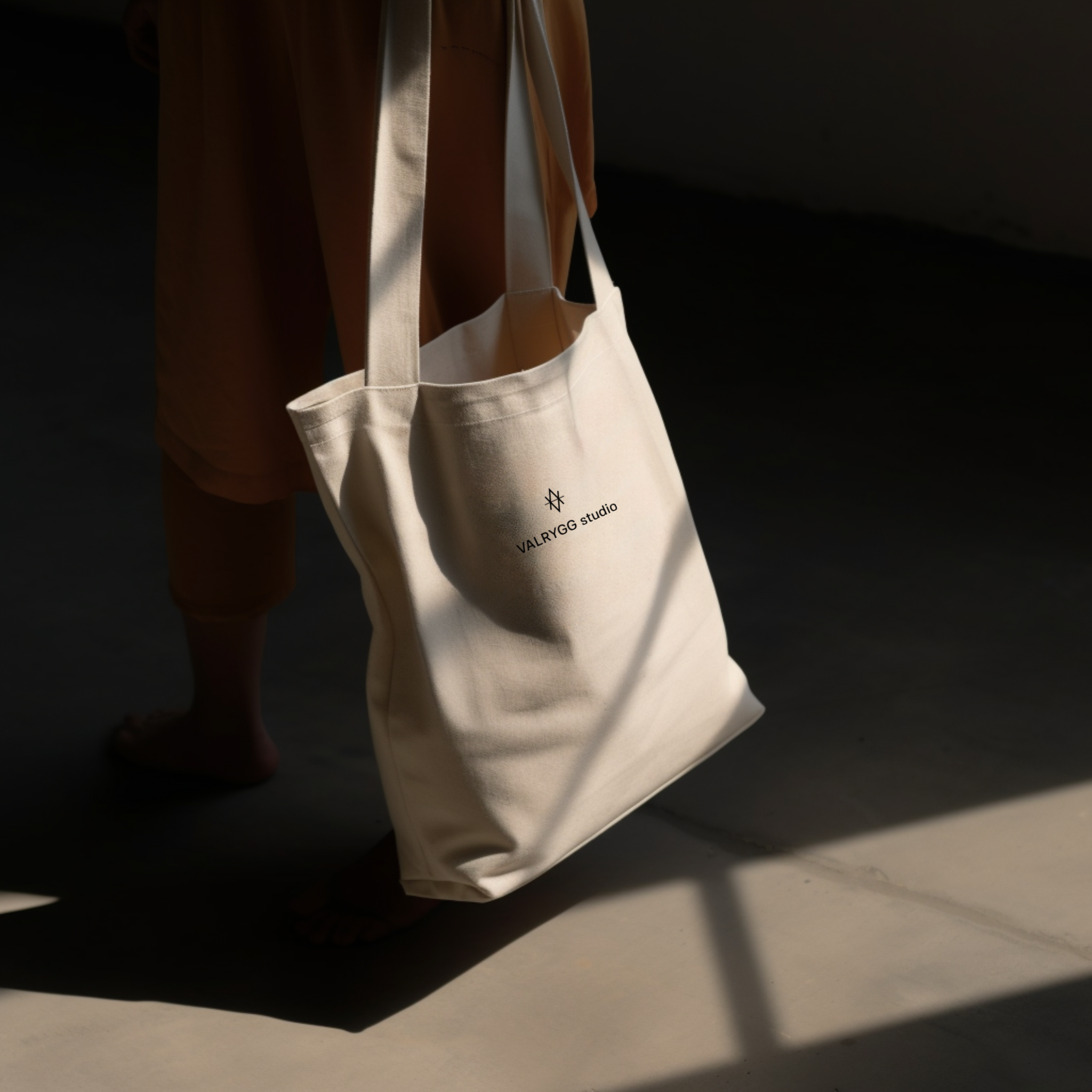 Organic cotton tote bag with dual straps, spacious design, perfect for groceries and books.