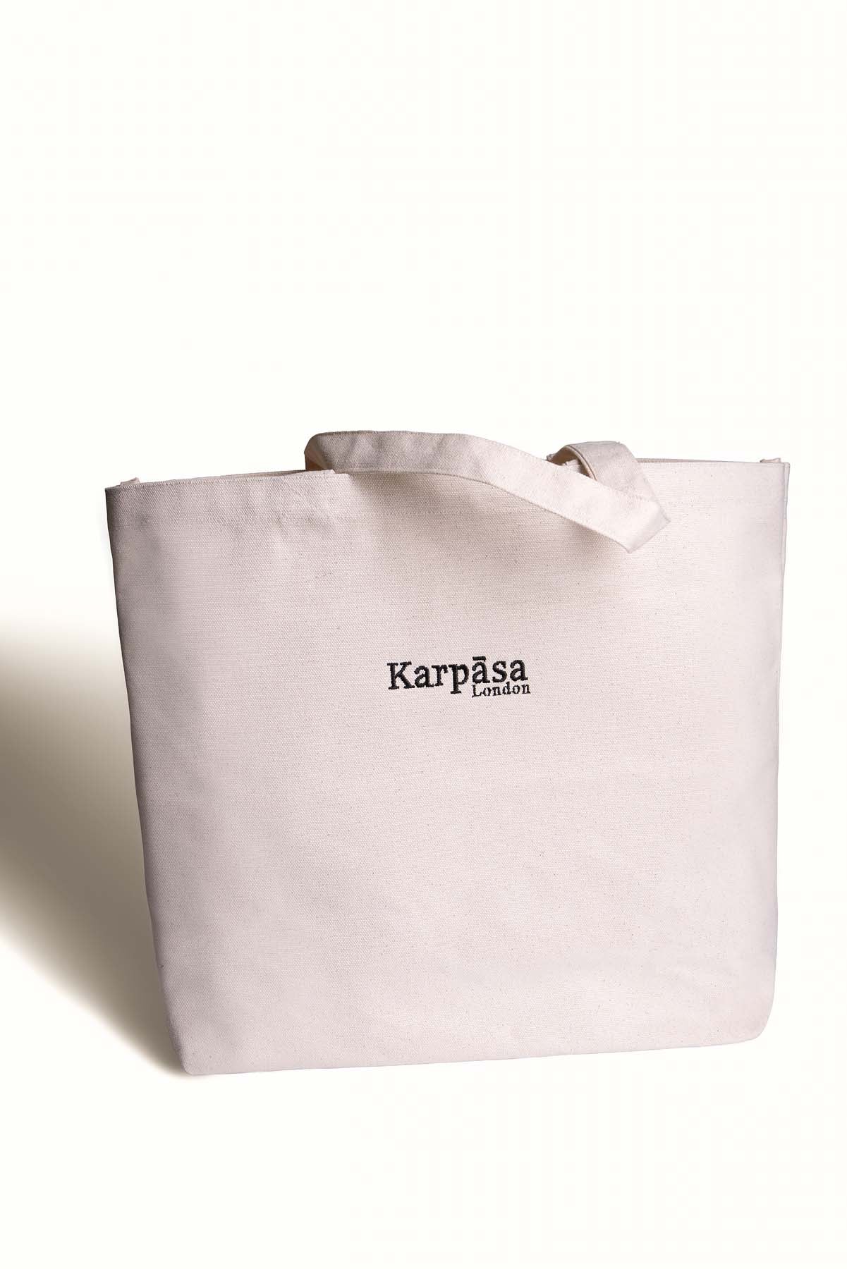 A natural organic cotton shopping bag with thick weave, perfect for eco-friendly shopping and daily errands.