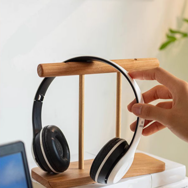 A handcrafted Page-Flipping Wooden Desktop Calendar made from rubber wood, cherry wood, and ash wood, showcasing its unique design and natural colors.