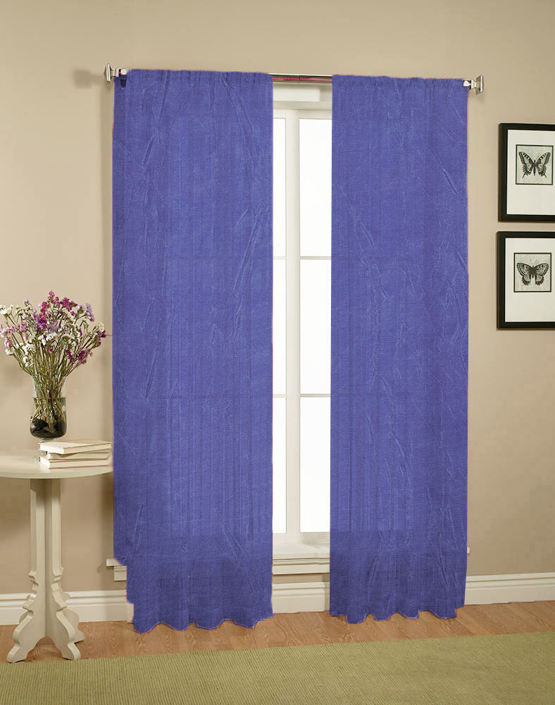 A pair of elegant blue crushed sheer curtains hanging gracefully, enhancing the decor of a room.