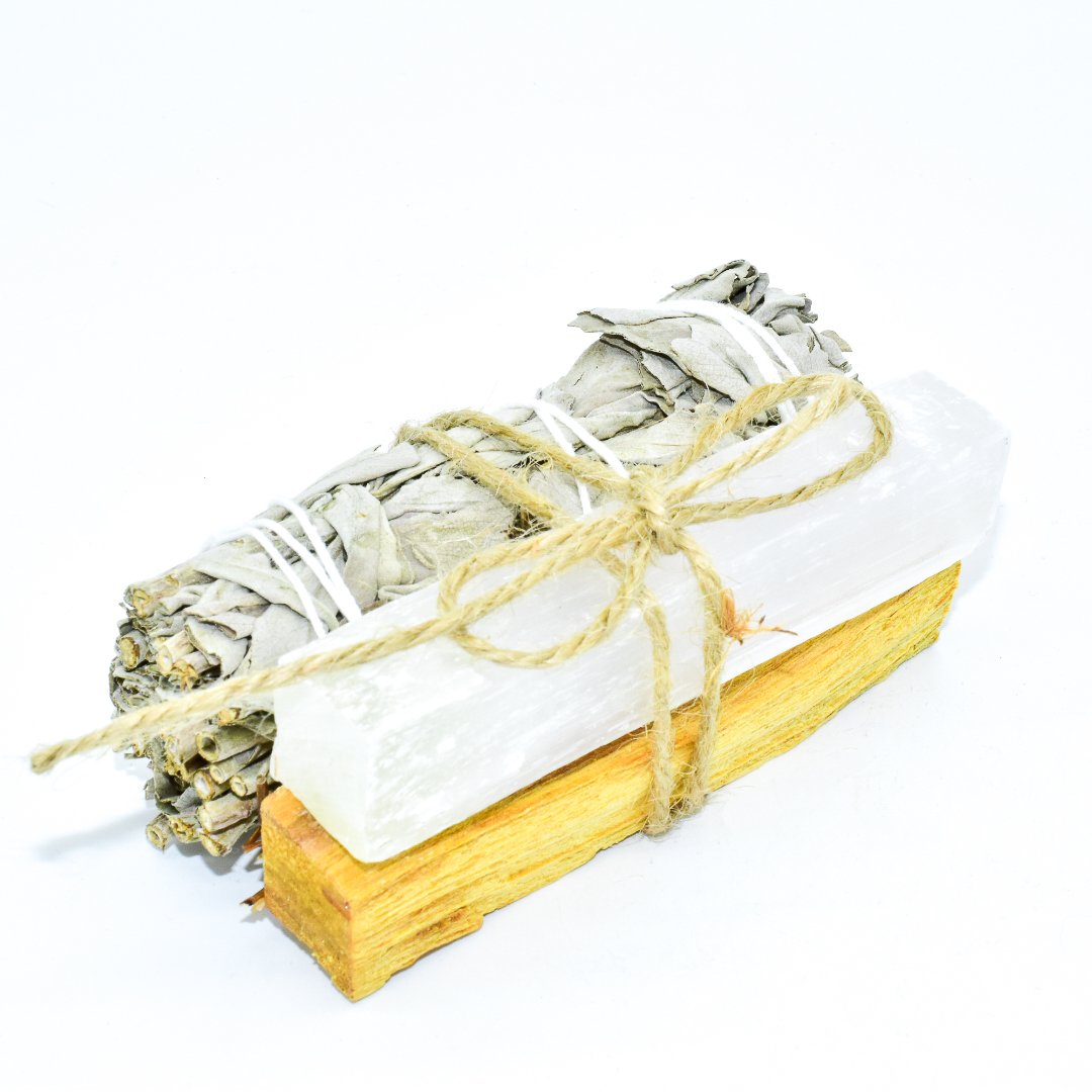 Palo Santo and Sage smudging bundle with assorted crystals, showcasing natural wood and vibrant crystal colors.