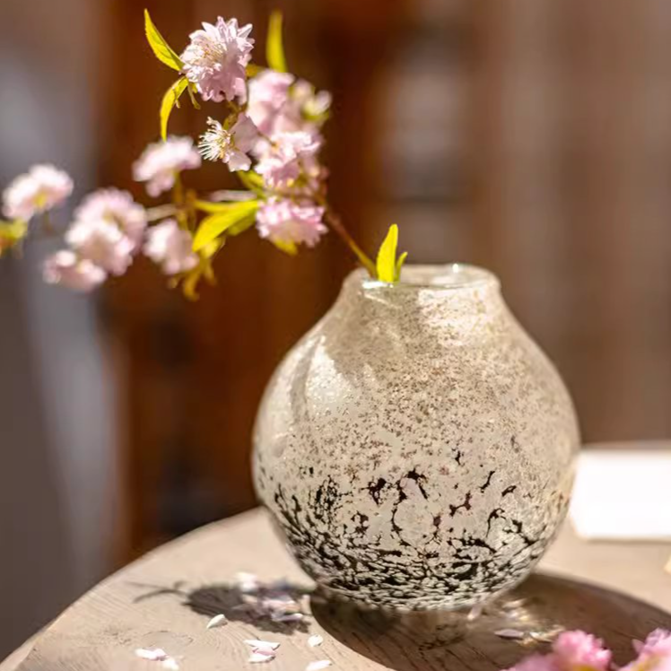 Pangu Glass Bud Vase showcasing hand-blown glass craftsmanship in black clear color, ideal for floral arrangements.