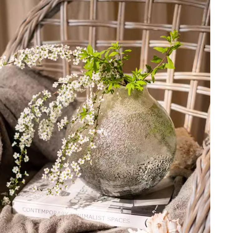 Pangu Glass Bud Vase showcasing hand-blown glass craftsmanship in black clear color, ideal for floral arrangements.