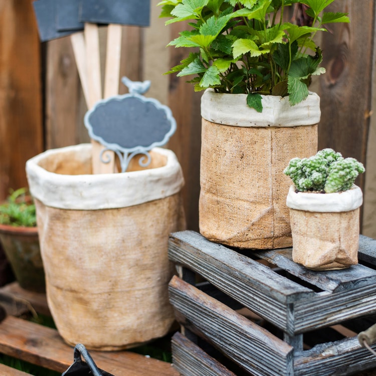 Paper Bag Style Concrete Garden Pot in khaki color, showcasing its unique design and drainage hole.