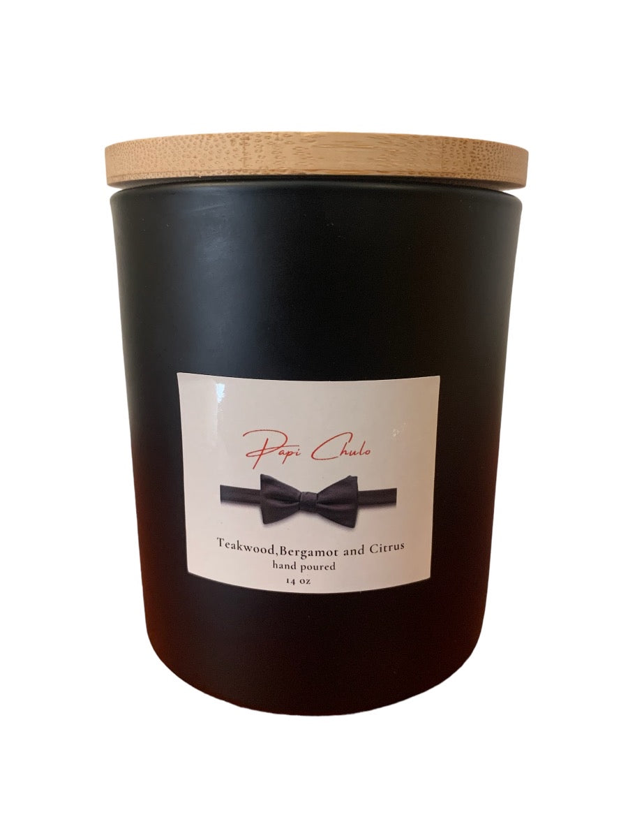 Papi Chulo 14 oz Soy Candle in a frosted container with a bamboo lid, showcasing its elegant design and inviting fragrance.