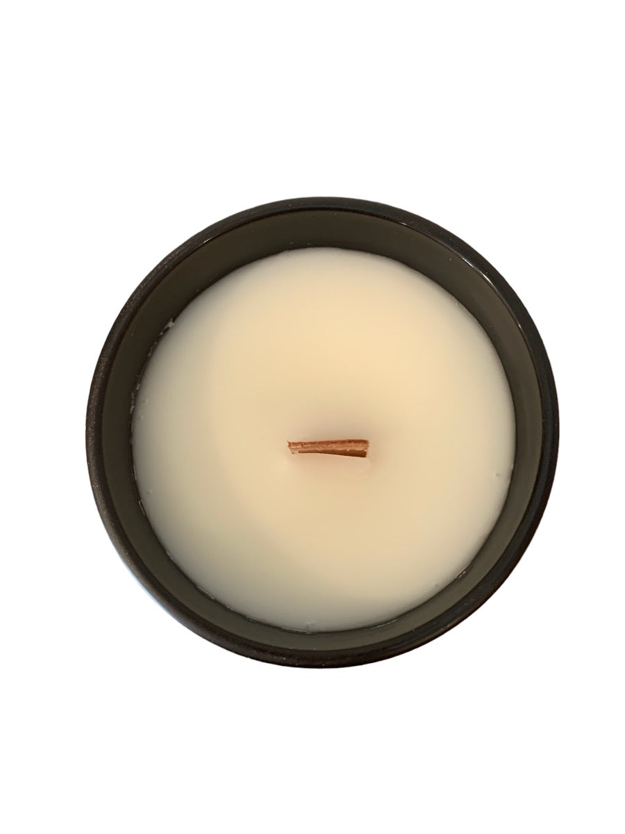 Papi Chulo 14 oz Soy Candle in a frosted container with a bamboo lid, showcasing its elegant design and inviting fragrance.