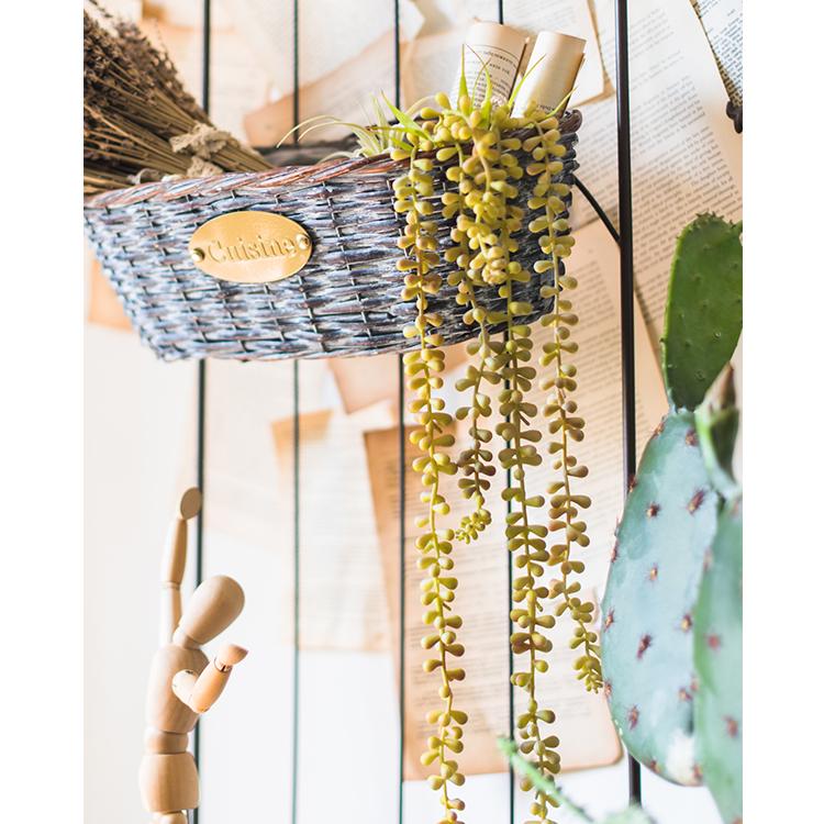 A 26-inch long Pearl Hanging Succulent Stem featuring realistic green and pale yellow leaves, perfect for home or office decor.