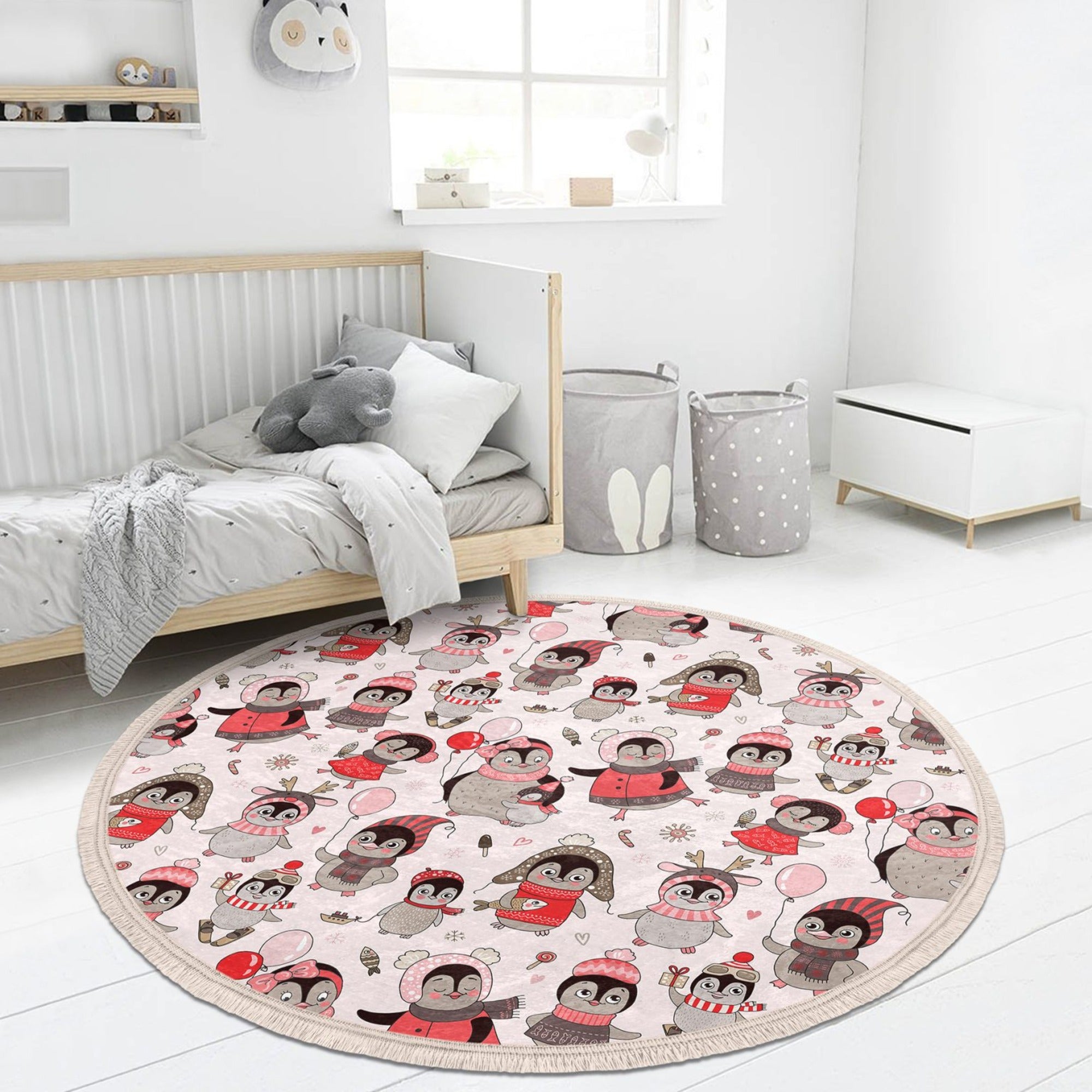 A colorful round rug featuring playful penguins, designed for kids' rooms and nurseries, made from soft velvet fabric.