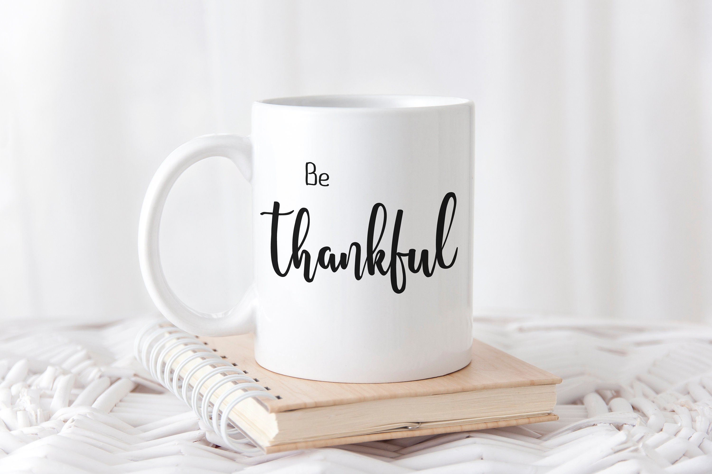 Personalized 'Be Thankful' coffee mug with hand lettered design, showcasing inspirational message on both sides.