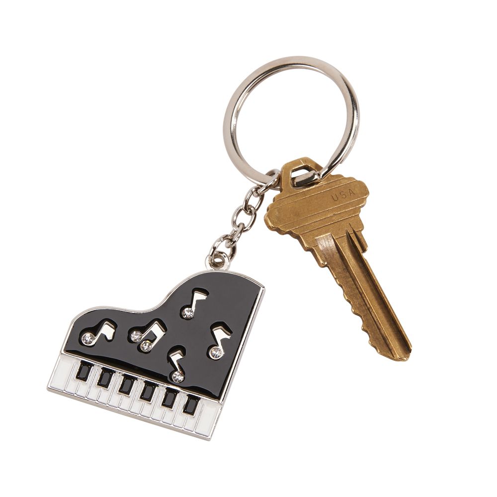 A 3.5-inch piano keychain adorned with sparkling crystals and whimsical music notes, featuring a nickelplated back for engraving.