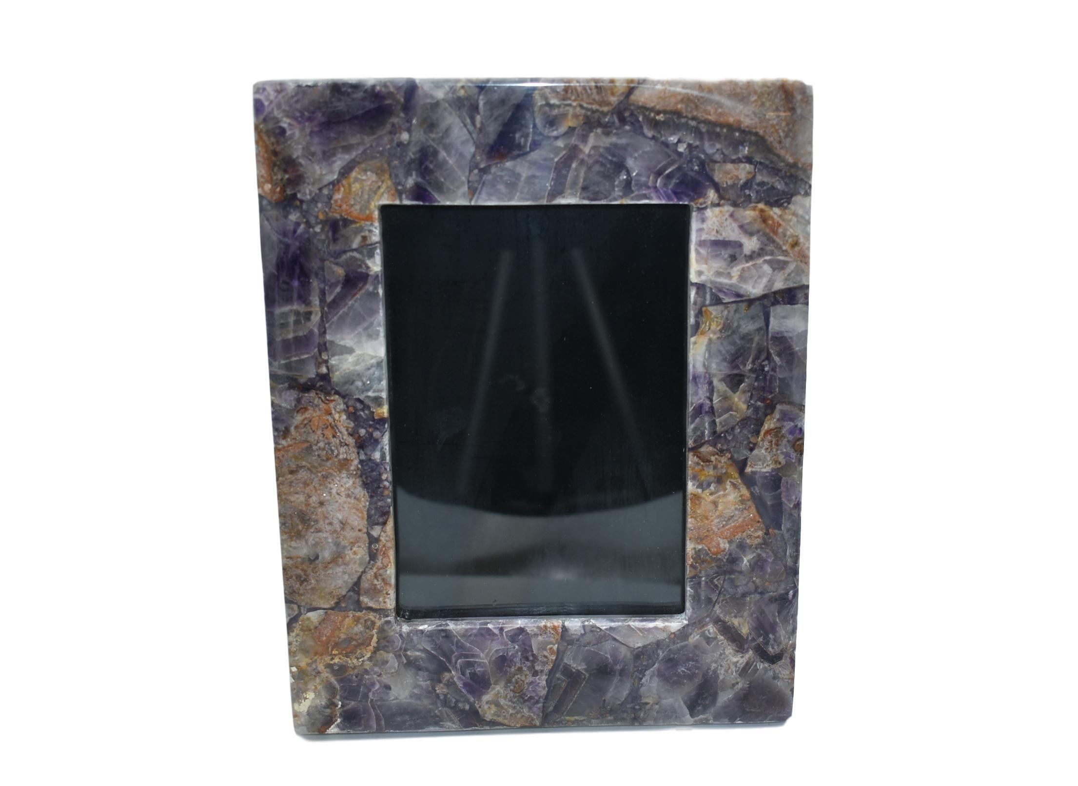 A collection of elegant gemstone picture frames in various sizes featuring amethyst, grey agate, rose quartz, and white quartz borders.