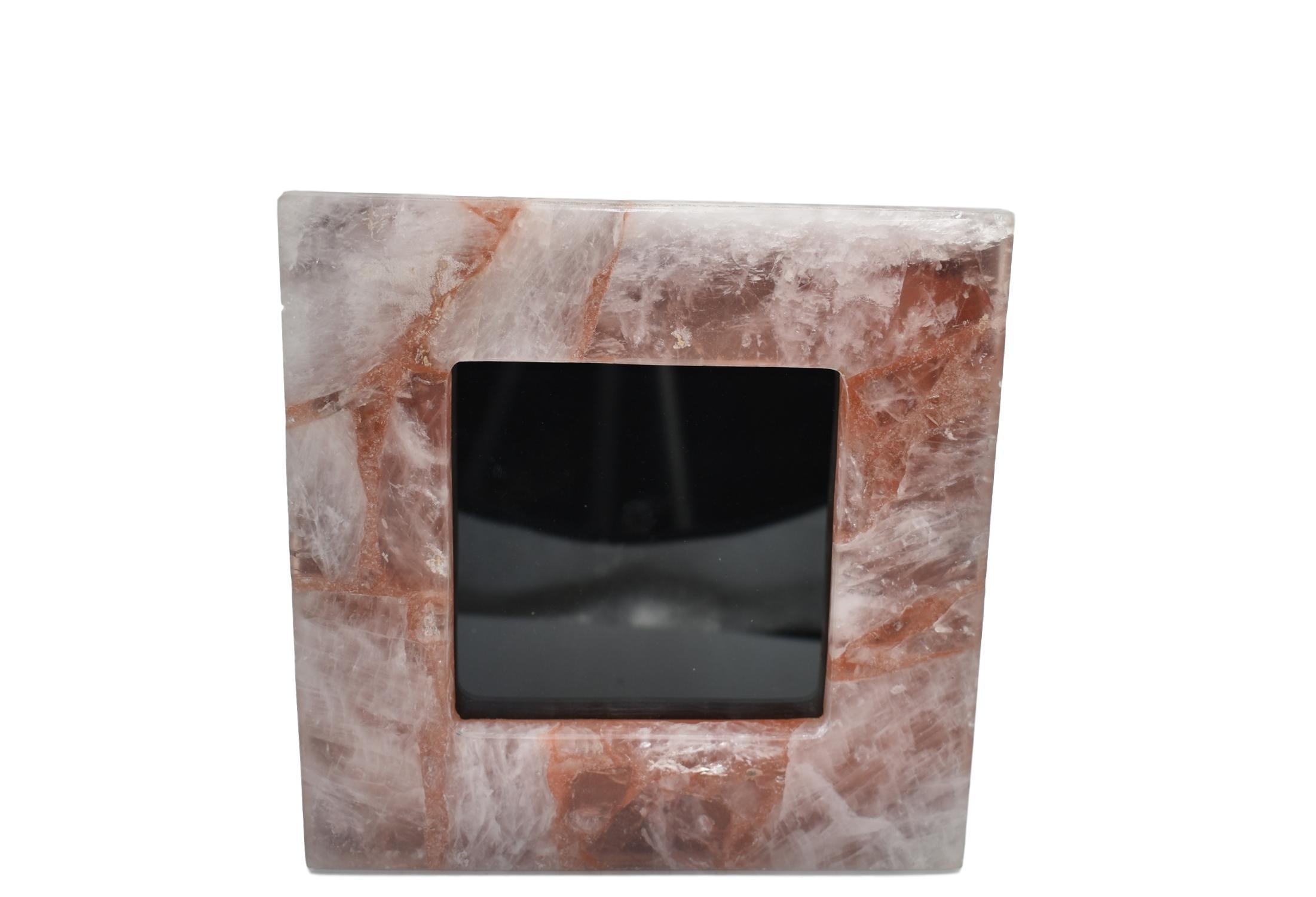 A collection of elegant gemstone picture frames in various sizes featuring amethyst, grey agate, rose quartz, and white quartz borders.