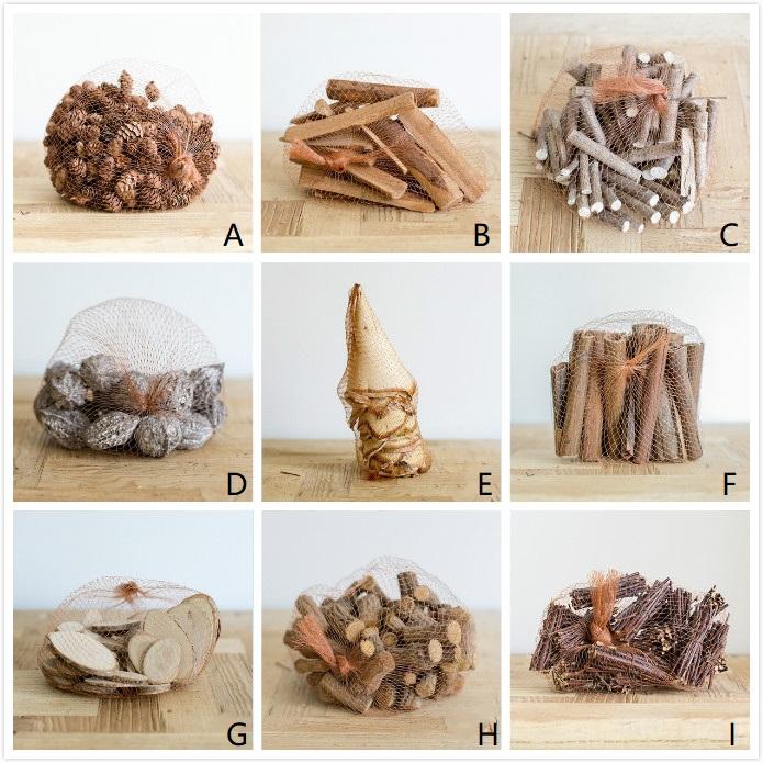 A collection of natural pine cones and wood pieces in various shapes and sizes, perfect for holiday decoration.