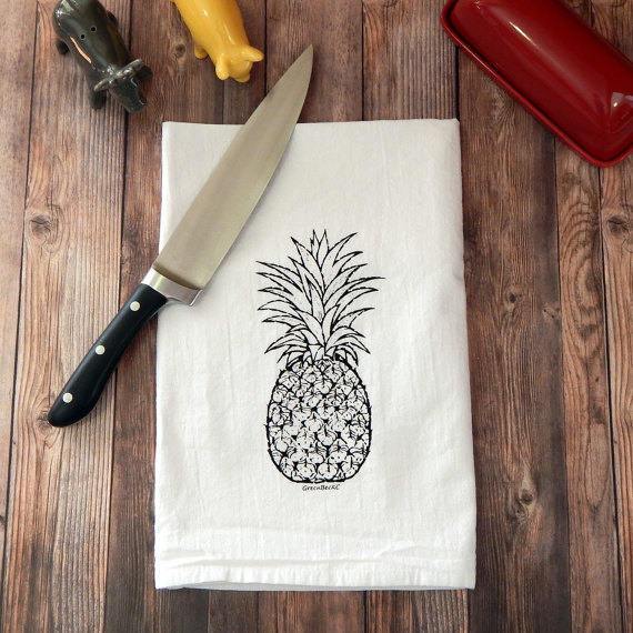 Pineapple Hospitality Flour Sack Tea Towel, hand-printed on 100% cotton, featuring a white background and a hanging loop.