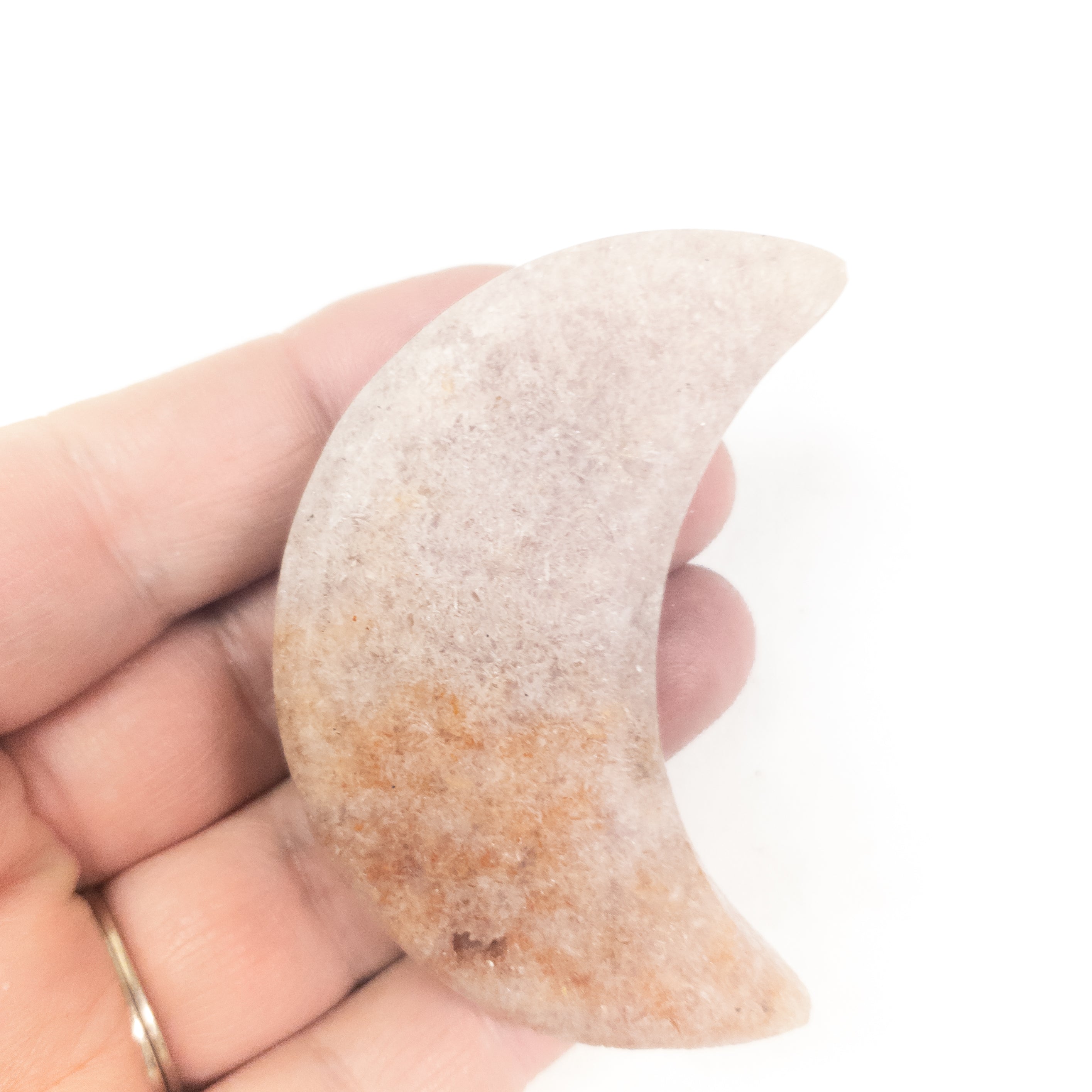 Handcrafted Pink Amethyst Crescent Moons showcasing unique colors and shapes, perfect for spiritual practices and home decor.