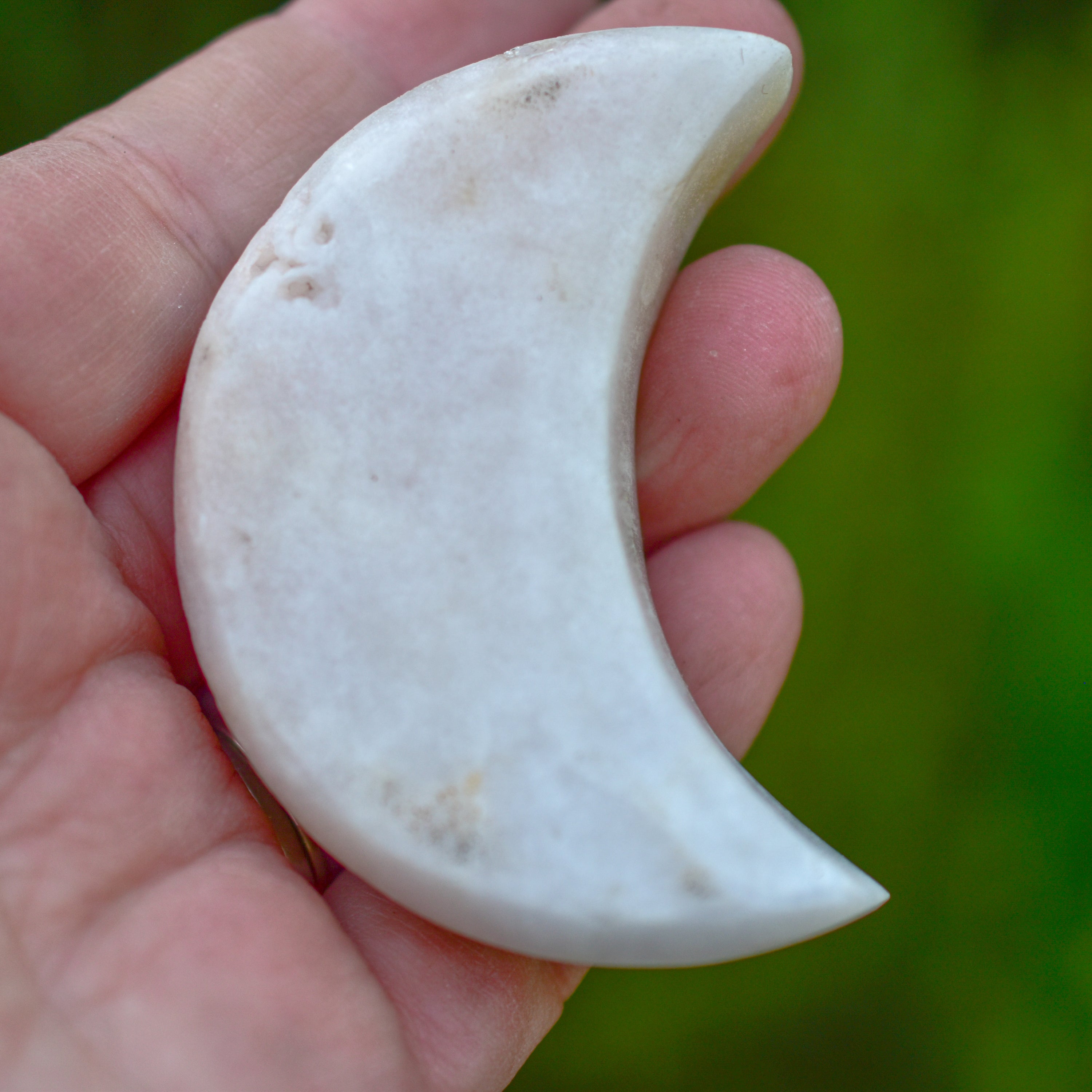 Handcrafted Pink Amethyst Crescent Moons showcasing unique colors and shapes, perfect for spiritual practices and home decor.