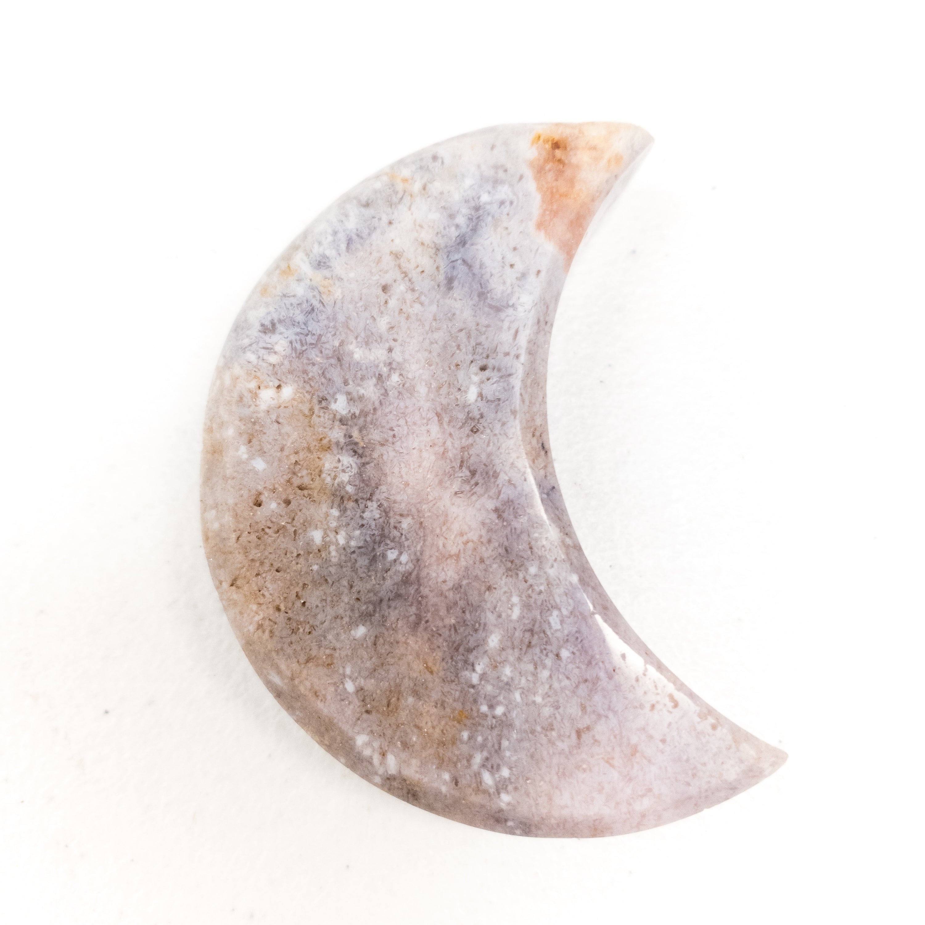 Handcrafted Pink Amethyst Crescent Moons showcasing unique colors and shapes, perfect for spiritual practices and home decor.