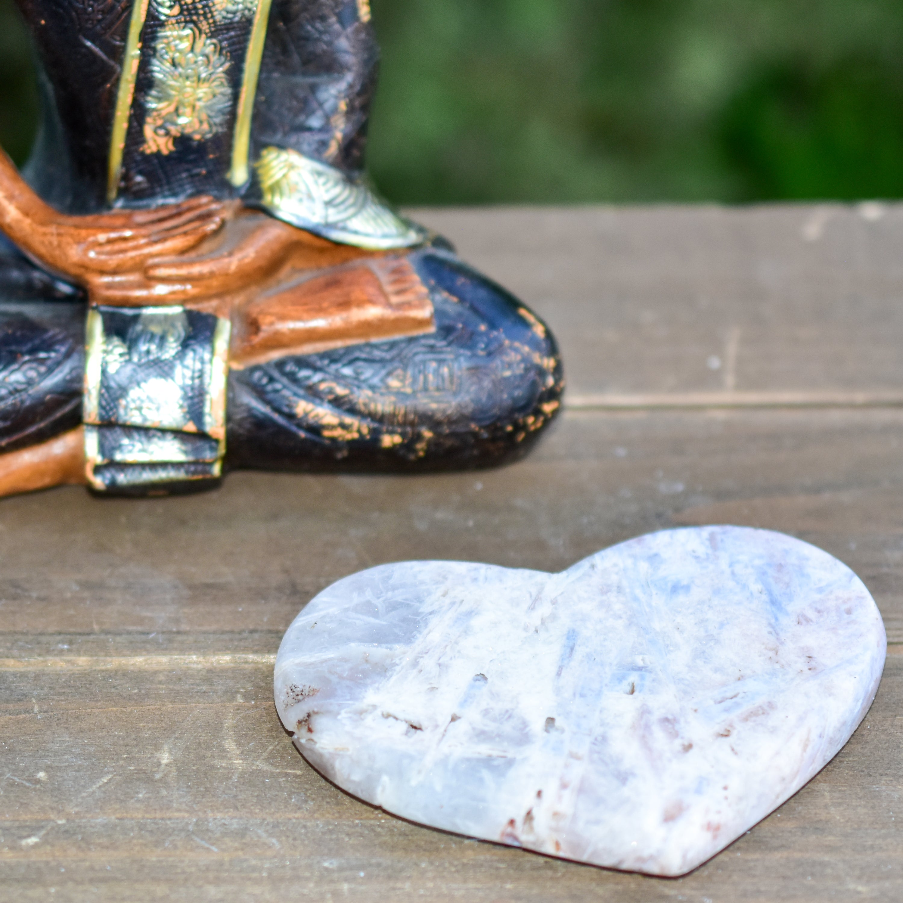 A collection of hand-cut Pink Amethyst hearts showcasing unique colors and sizes, polished to perfection by artisans in Brazil.