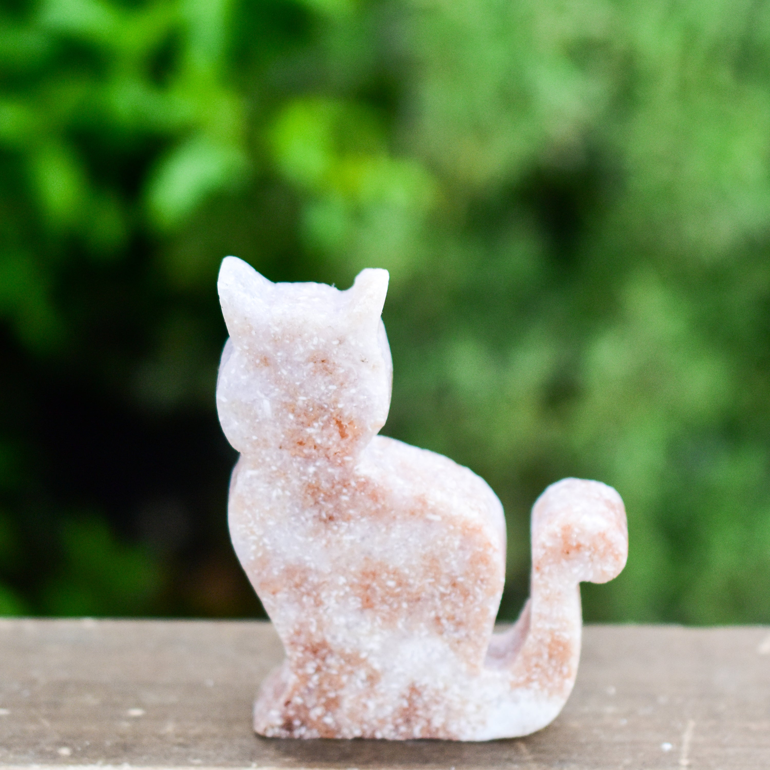 Two hand-crafted Pink Amethyst Sitting Cats, showcasing their unique colors and polished finish, perfect for home decor.