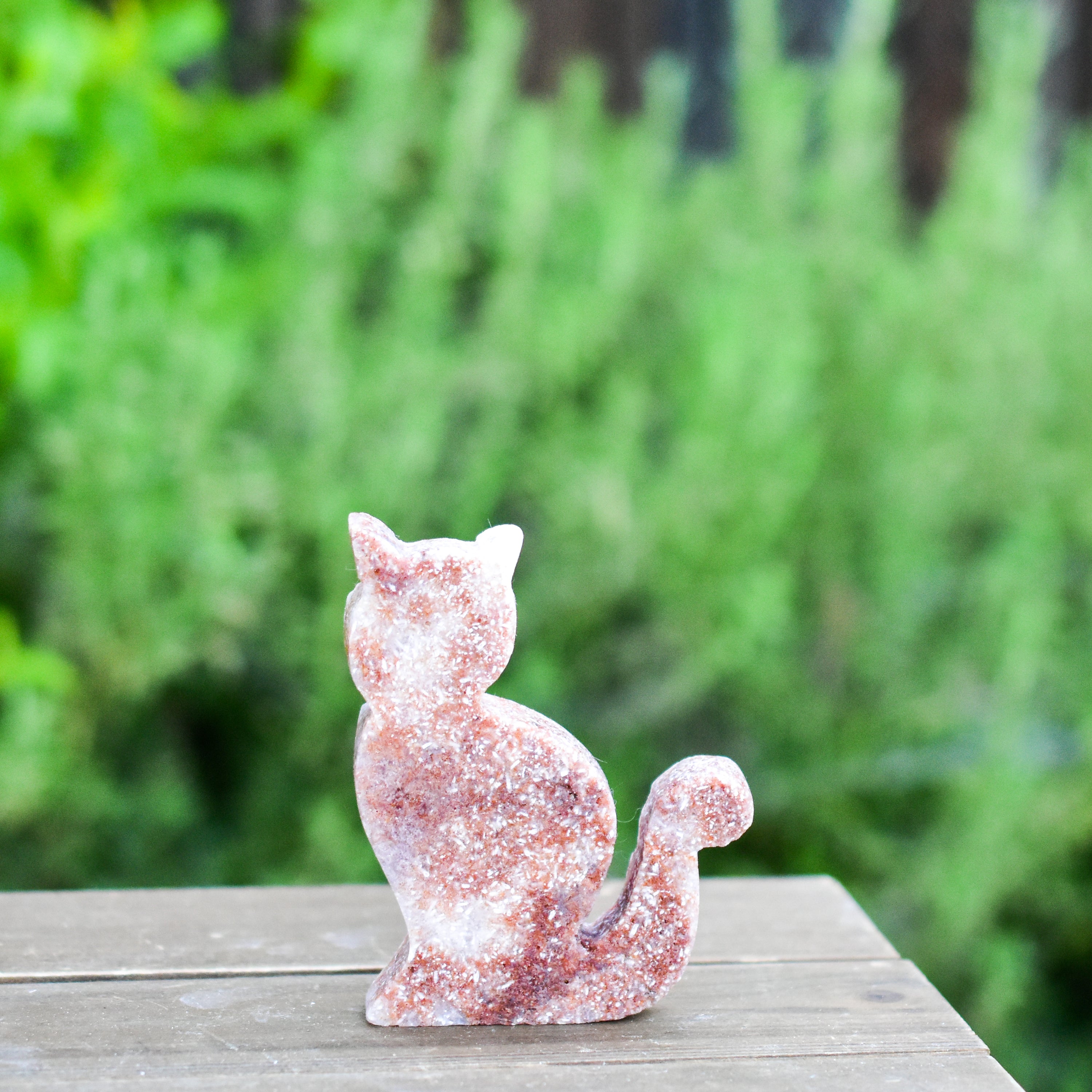 Two hand-crafted Pink Amethyst Sitting Cats, showcasing their unique colors and polished finish, perfect for home decor.