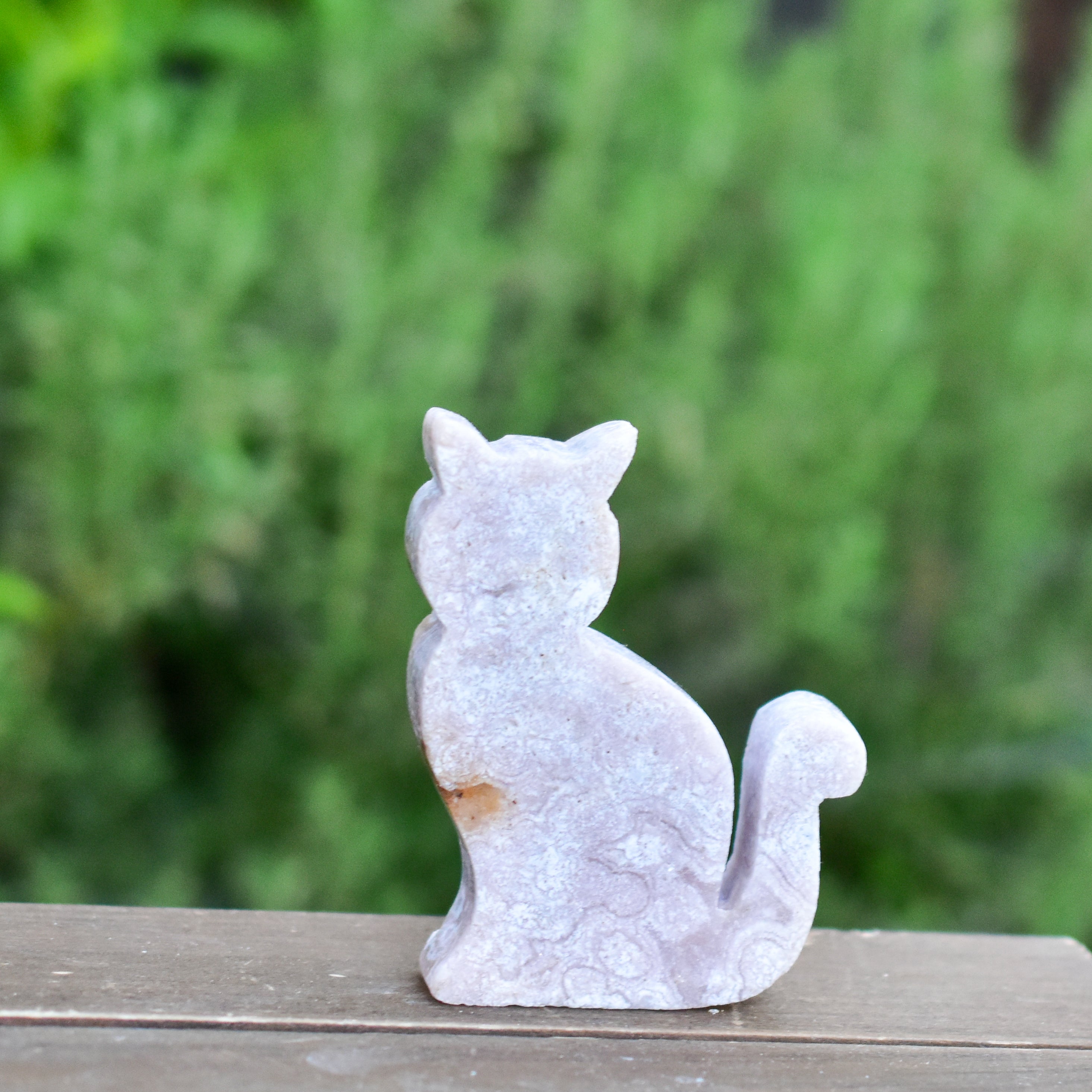 Two hand-crafted Pink Amethyst Sitting Cats, showcasing their unique colors and polished finish, perfect for home decor.