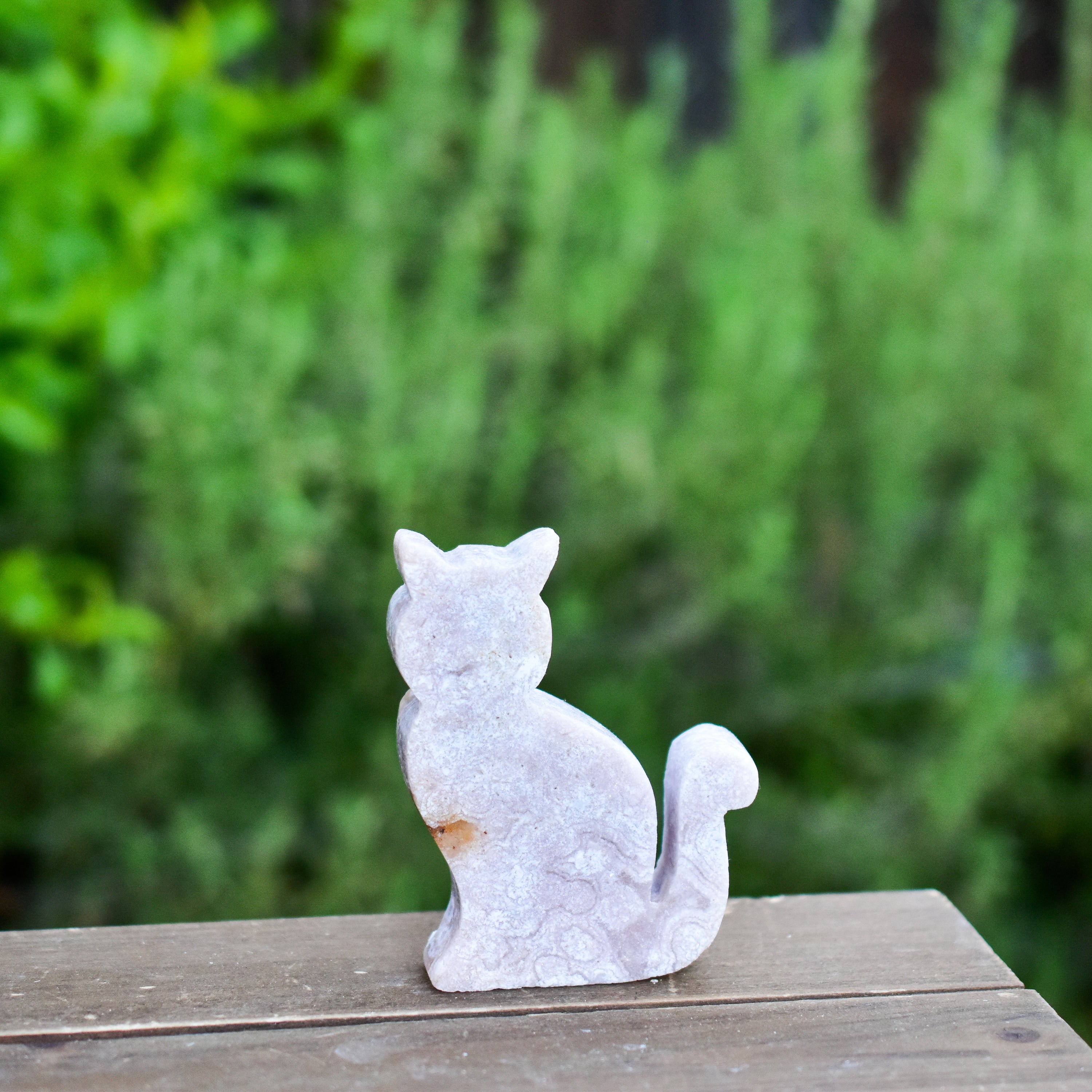 Two hand-crafted Pink Amethyst Sitting Cats, showcasing their unique colors and polished finish, perfect for home decor.