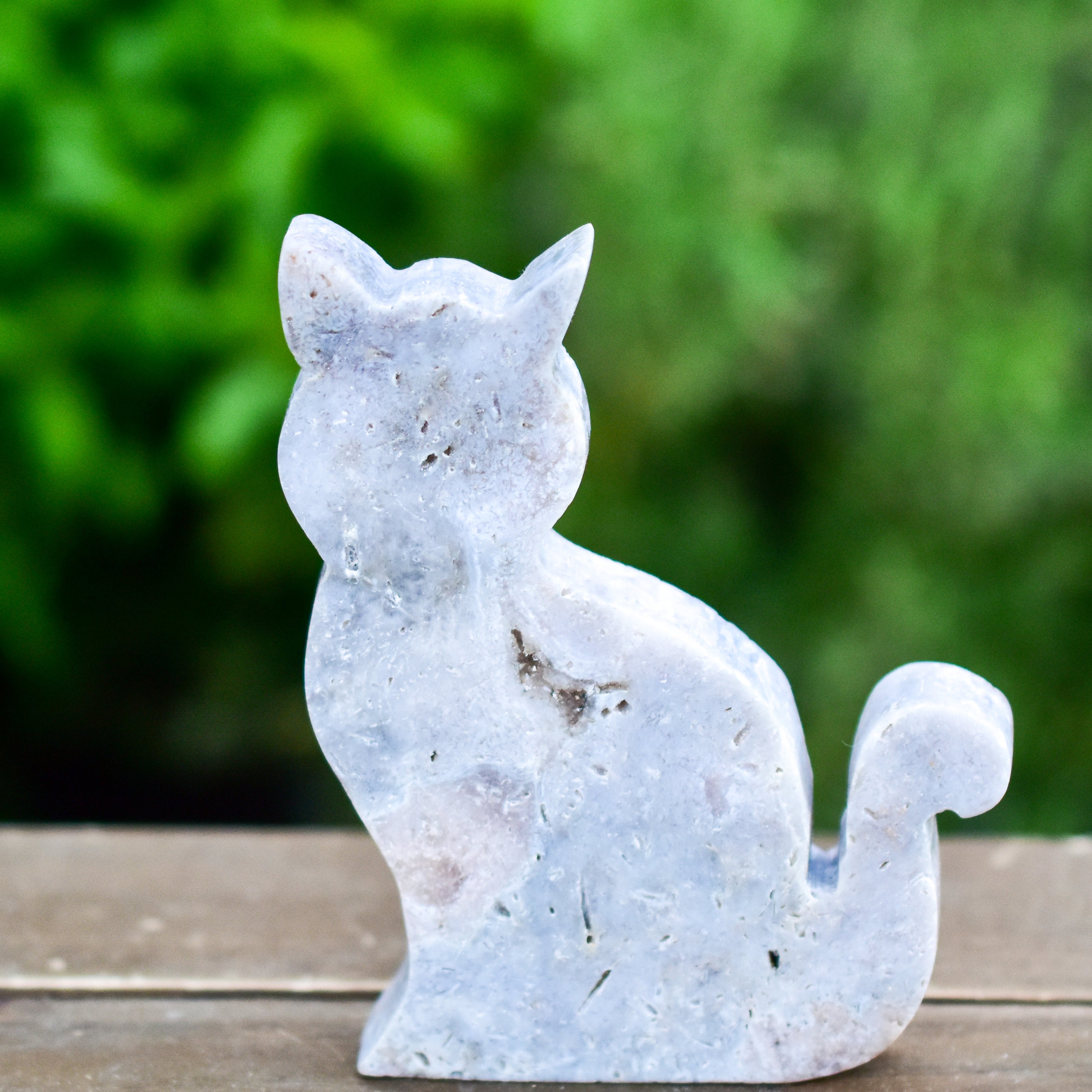 Two hand-crafted Pink Amethyst Sitting Cats, showcasing their unique colors and polished finish, perfect for home decor.