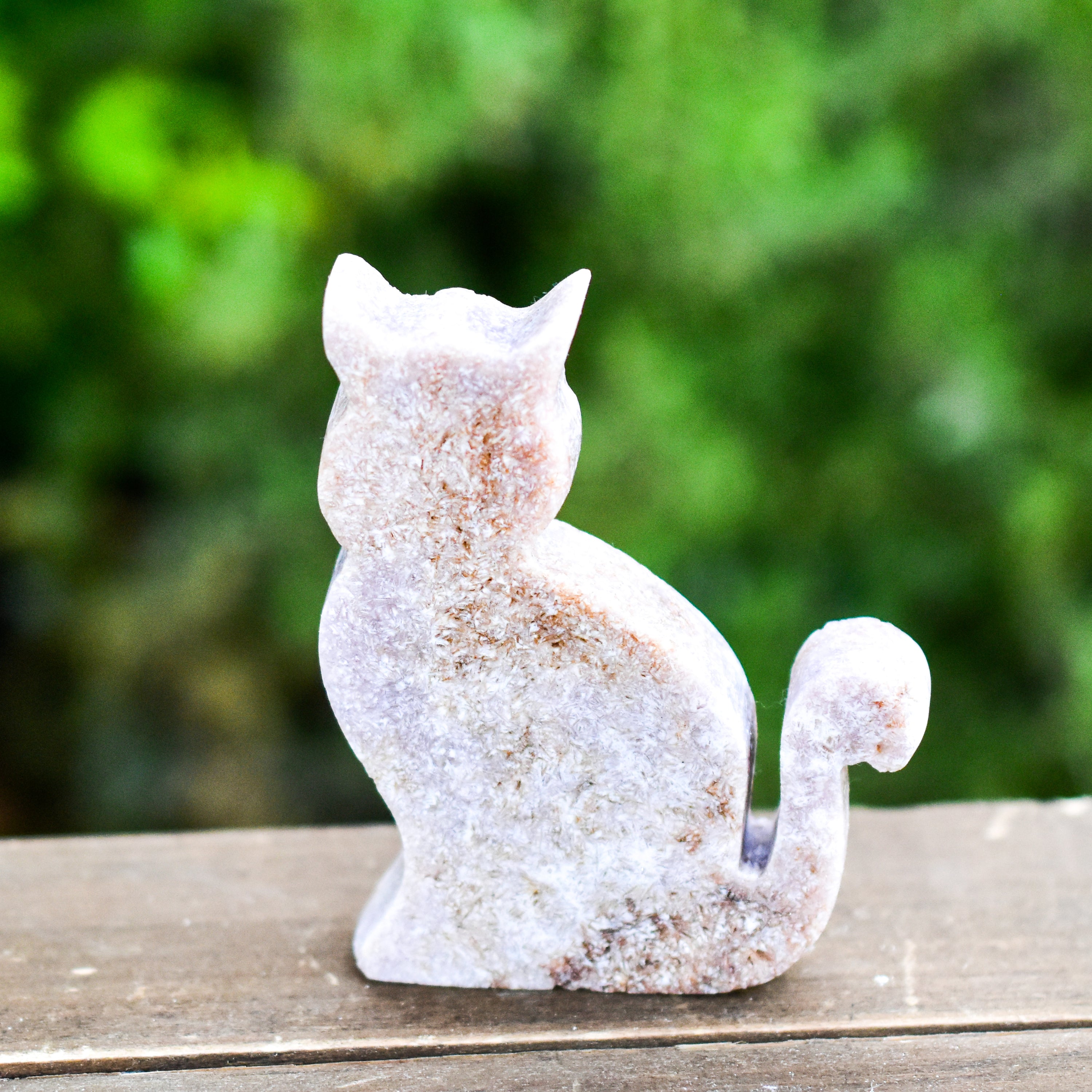 Two hand-crafted Pink Amethyst Sitting Cats, showcasing their unique colors and polished finish, perfect for home decor.