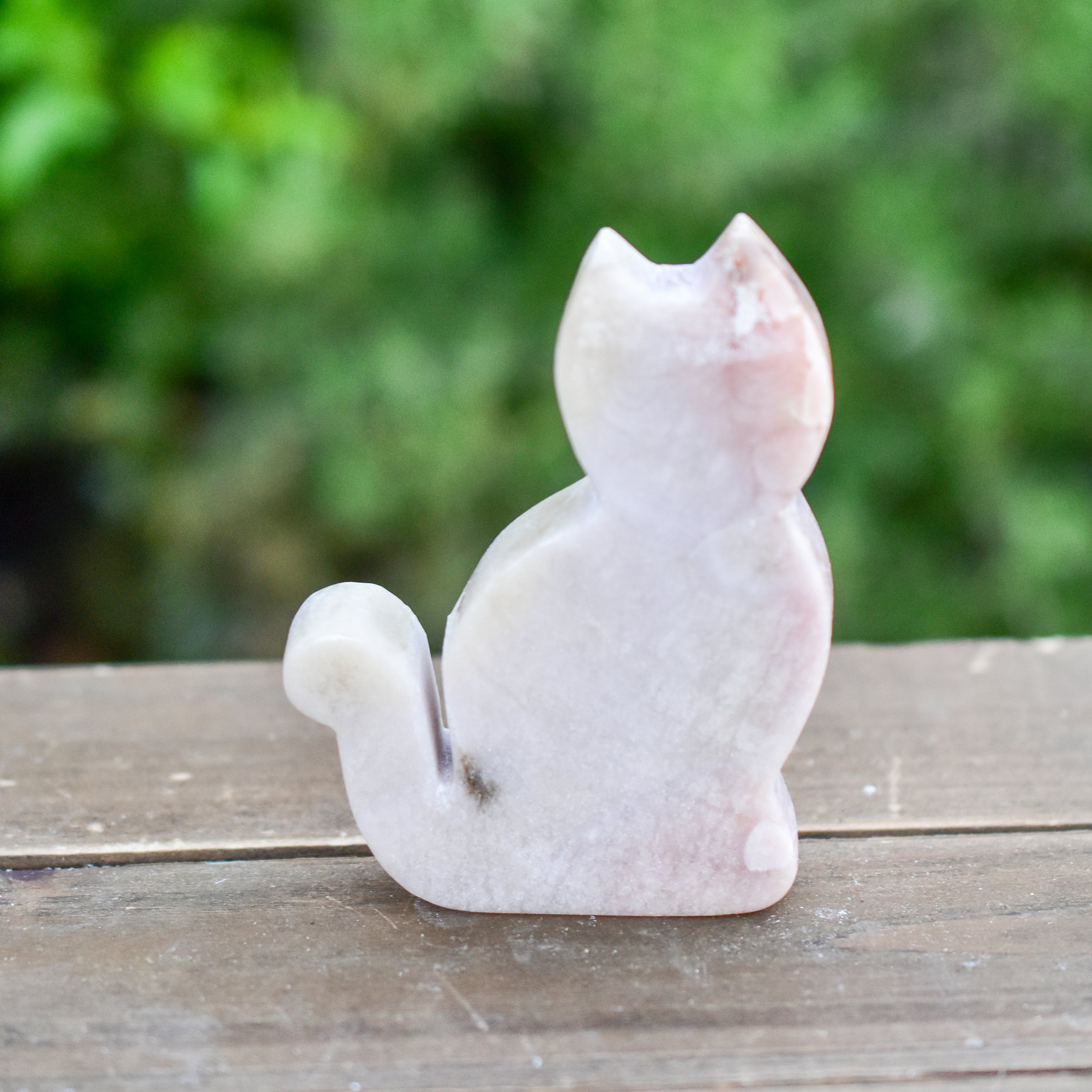 Two hand-crafted Pink Amethyst Sitting Cats, showcasing their unique colors and polished finish, perfect for home decor.