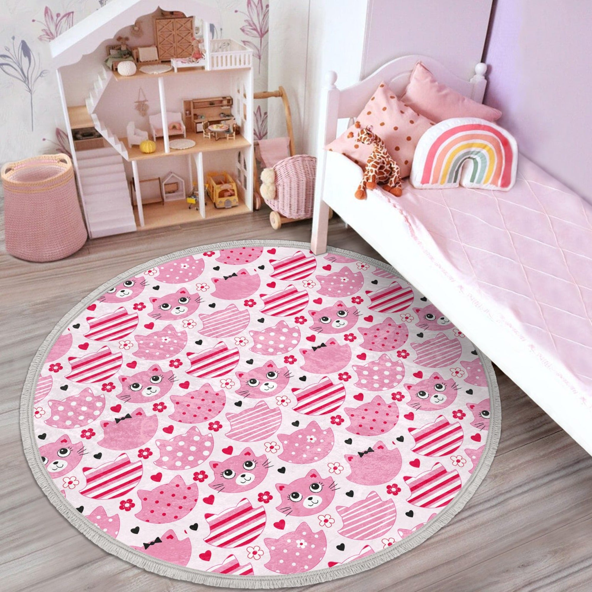 A round pink cat nursery rug featuring a cute cat design, made of shiny velvet fabric, perfect for kids' rooms.