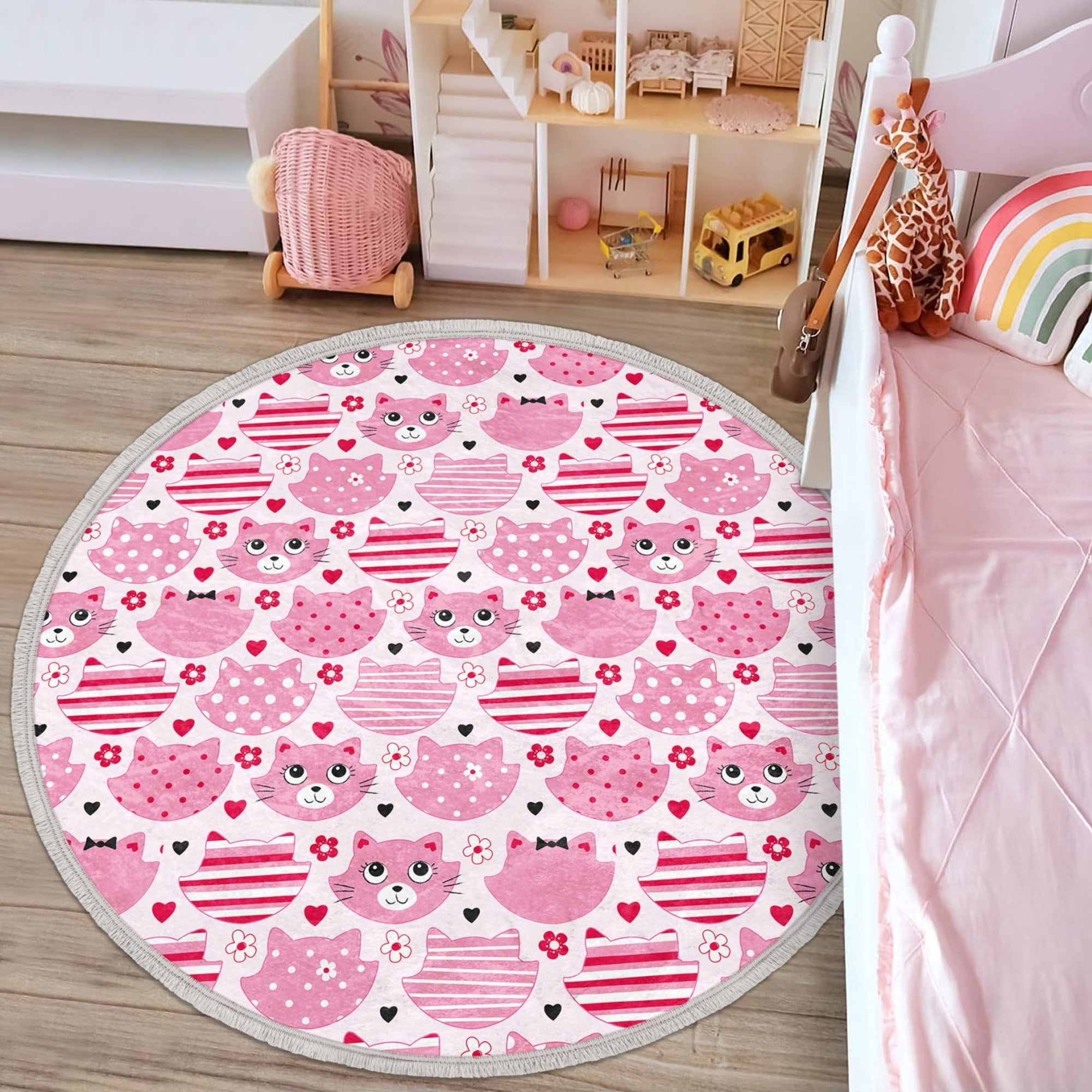 A round pink cat nursery rug featuring a cute cat design, made of shiny velvet fabric, perfect for kids' rooms.