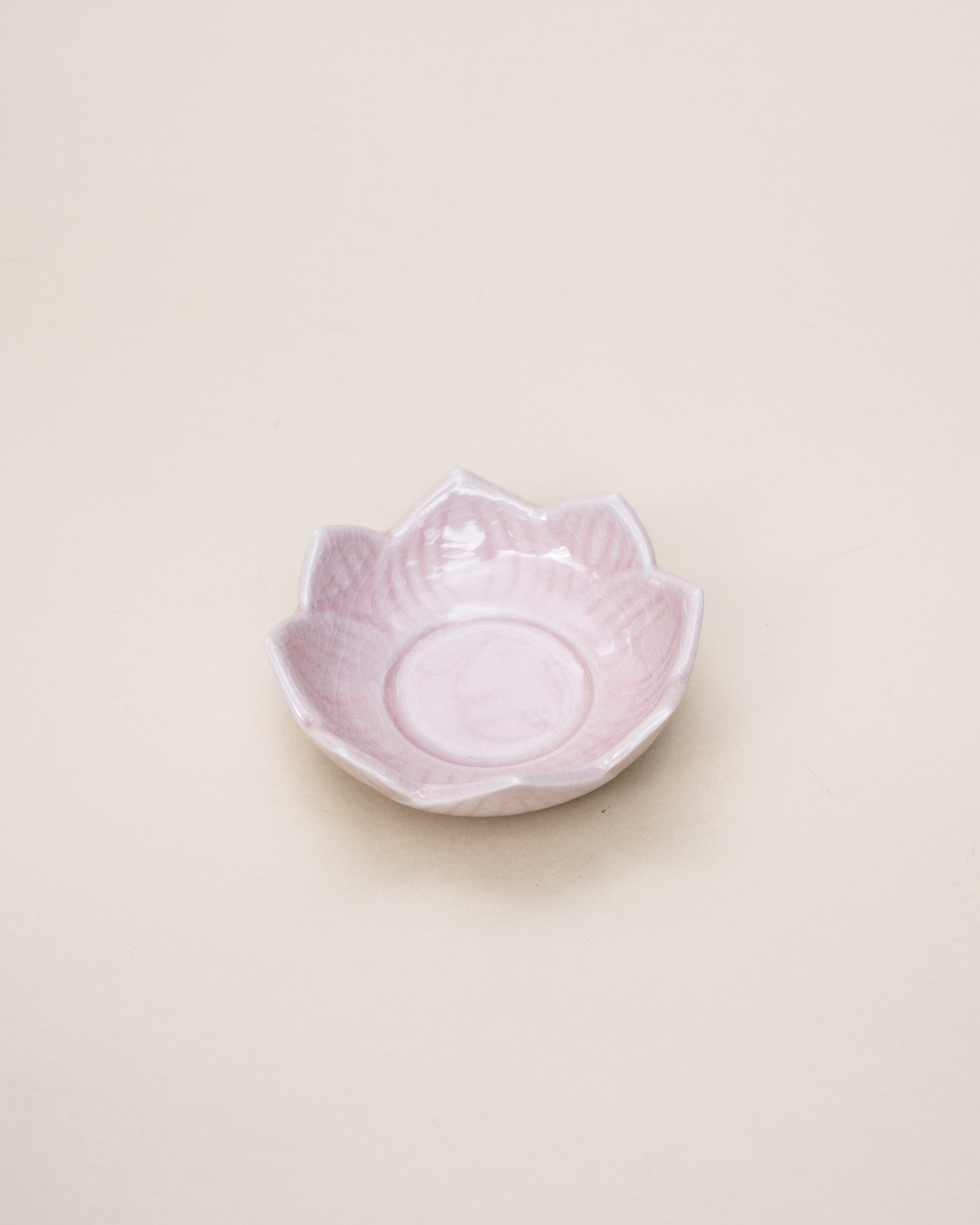 Handmade Pink Lotus Stoneware Tealight Holder featuring a delicate lotus design, perfect for standard tealight candles.