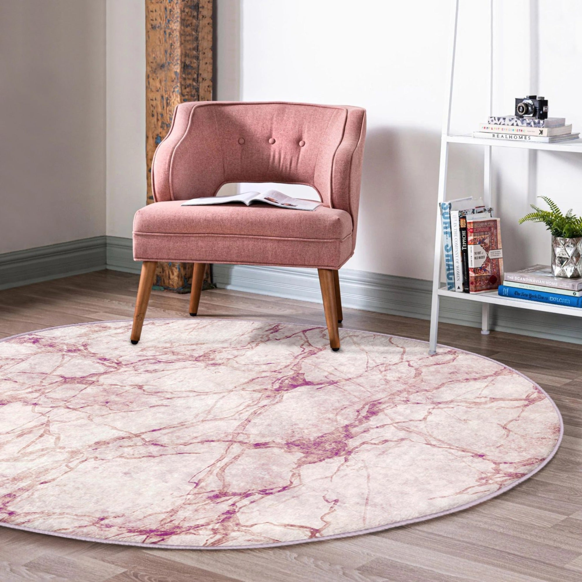 A stylish pink marble pattern round rug, perfect for home decor, showcasing a soft velvet texture and vibrant colors.