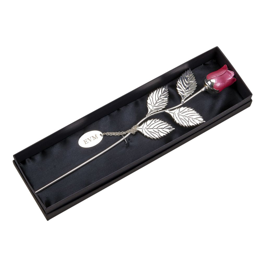 A stunning 12.75-inch silver-plated rose with a pink epoxy flower, elegantly displayed in a black satin-lined presentation box.