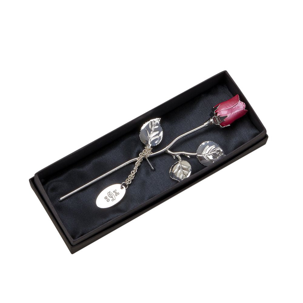 A beautiful 7.5-inch silver-plated rose with a pink epoxy flower, elegantly presented in a black satin-lined box.