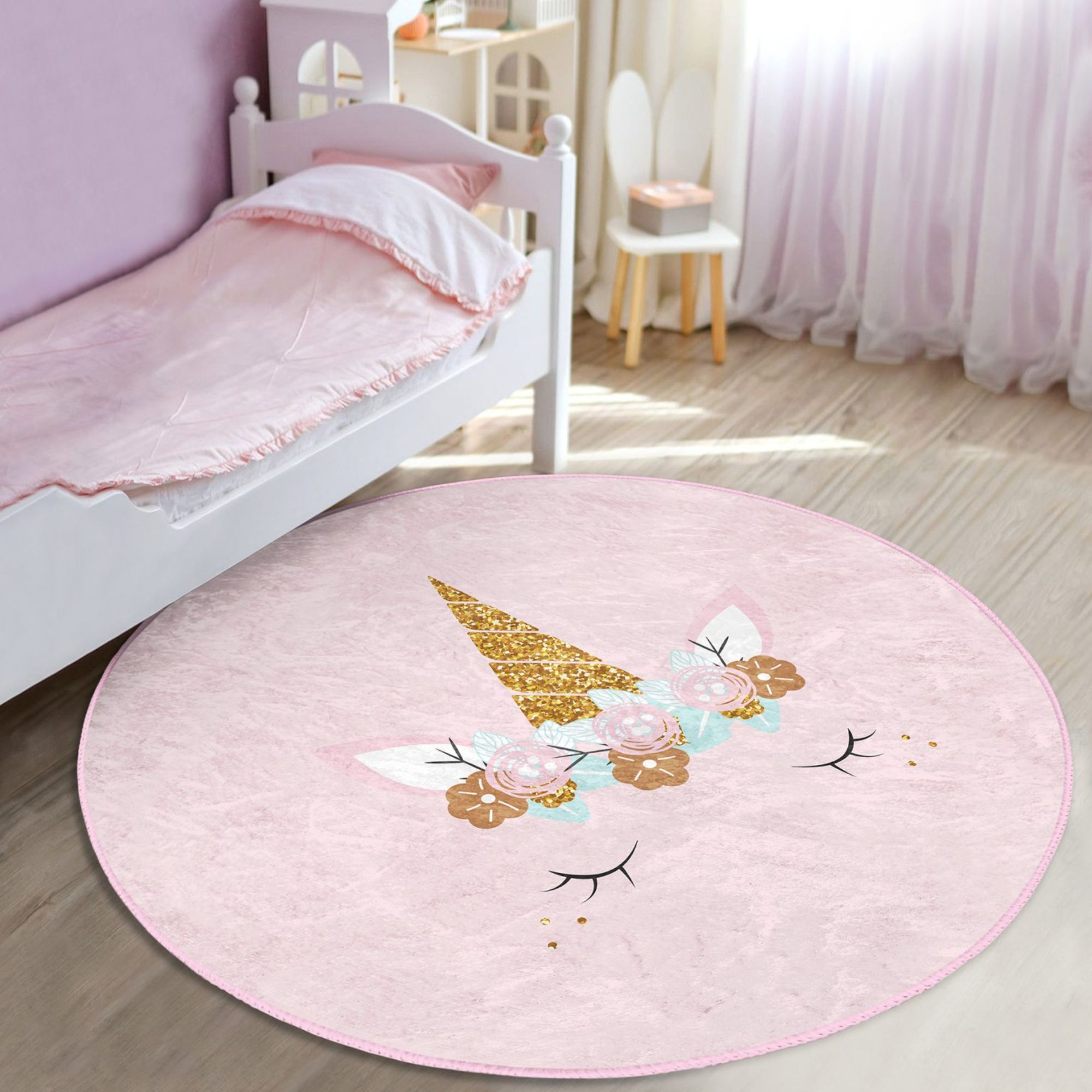 A soft pink unicorn baby room rug featuring a whimsical design, perfect for nurseries and playrooms.