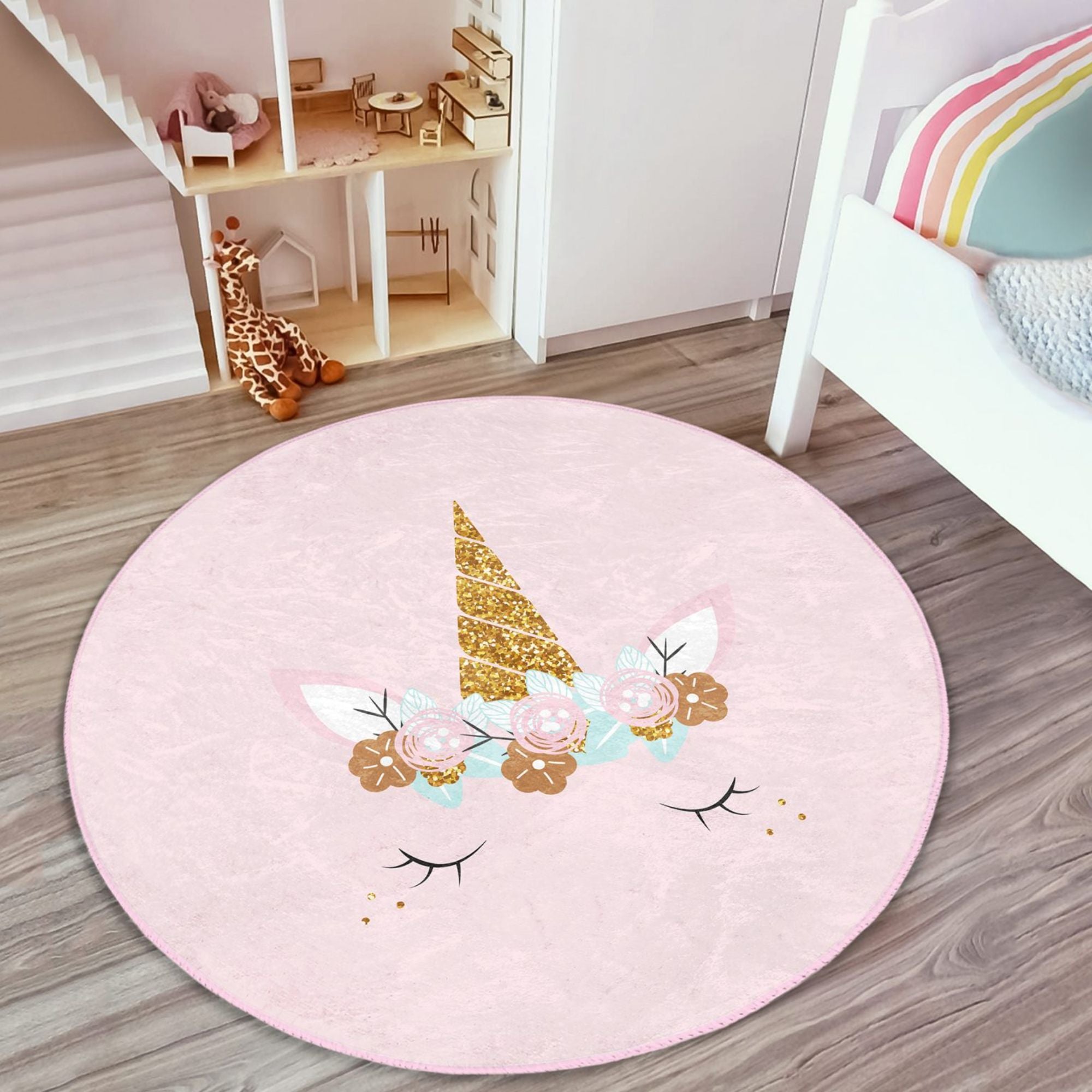 A soft pink unicorn baby room rug featuring a whimsical design, perfect for nurseries and playrooms.