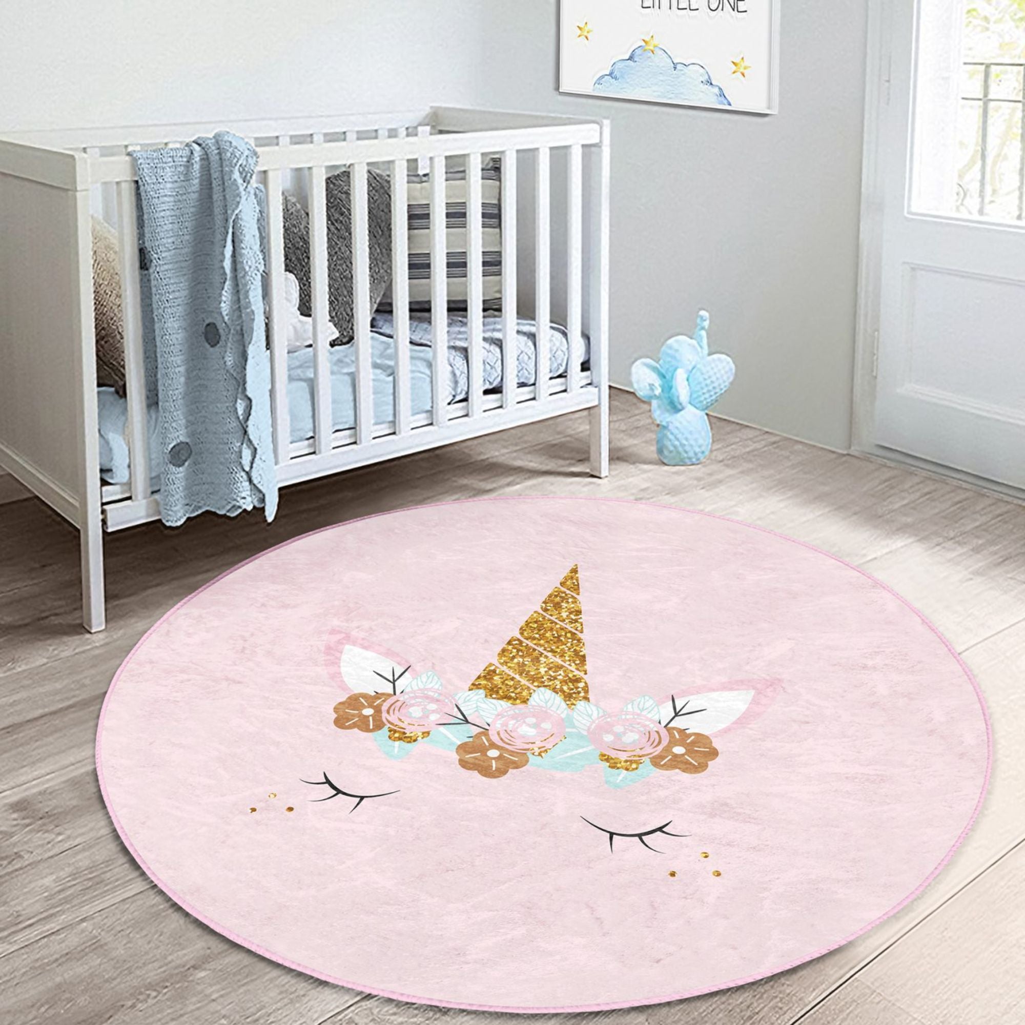 A soft pink unicorn baby room rug featuring a whimsical design, perfect for nurseries and playrooms.