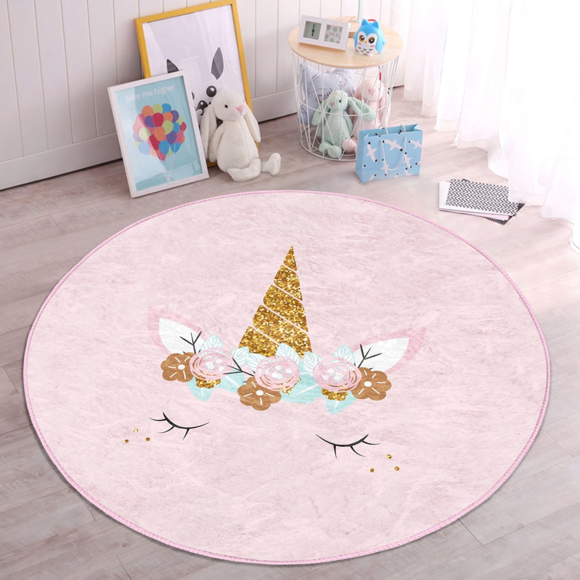 A soft pink unicorn baby room rug featuring a whimsical design, perfect for nurseries and playrooms.