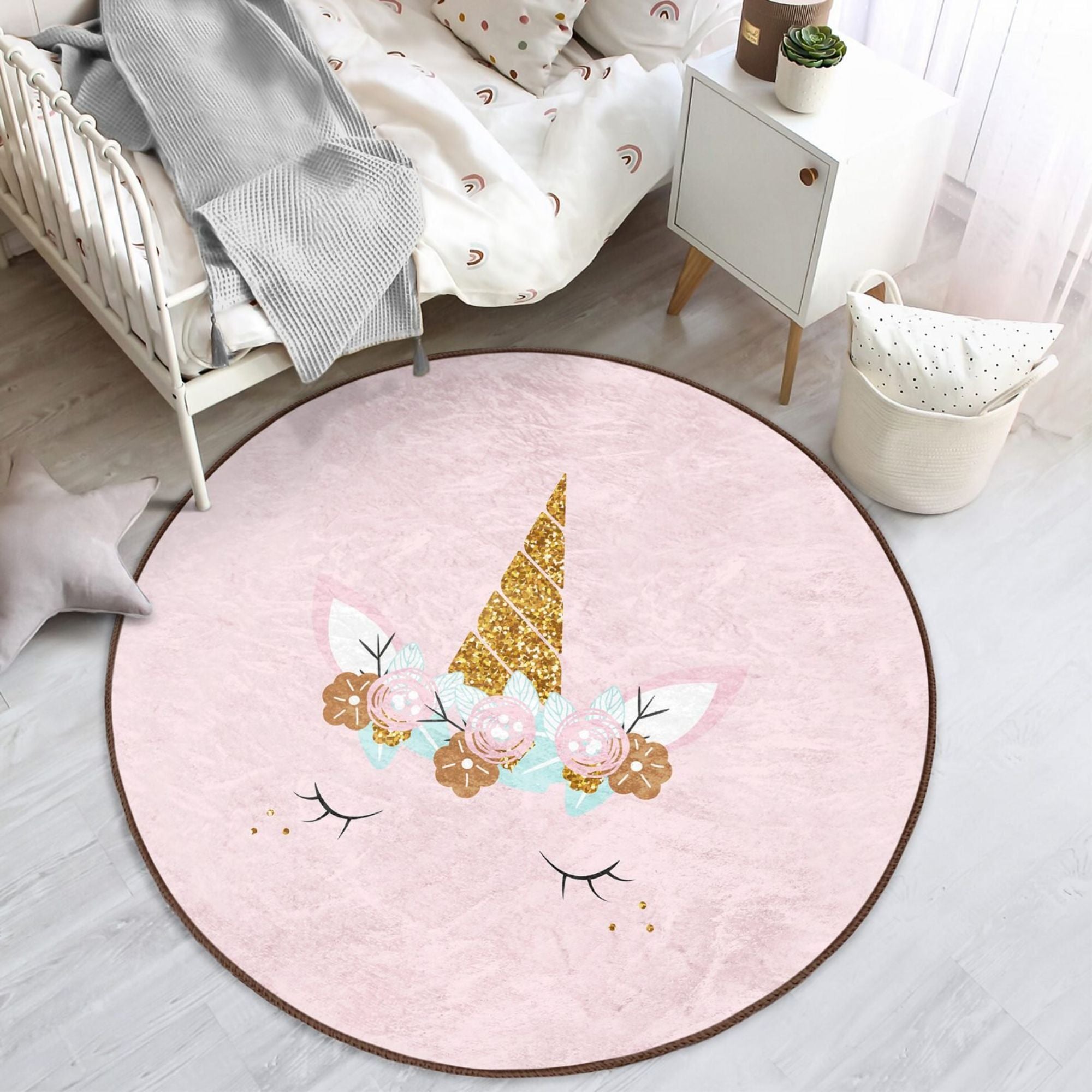 A soft pink unicorn baby room rug featuring a whimsical design, perfect for nurseries and playrooms.