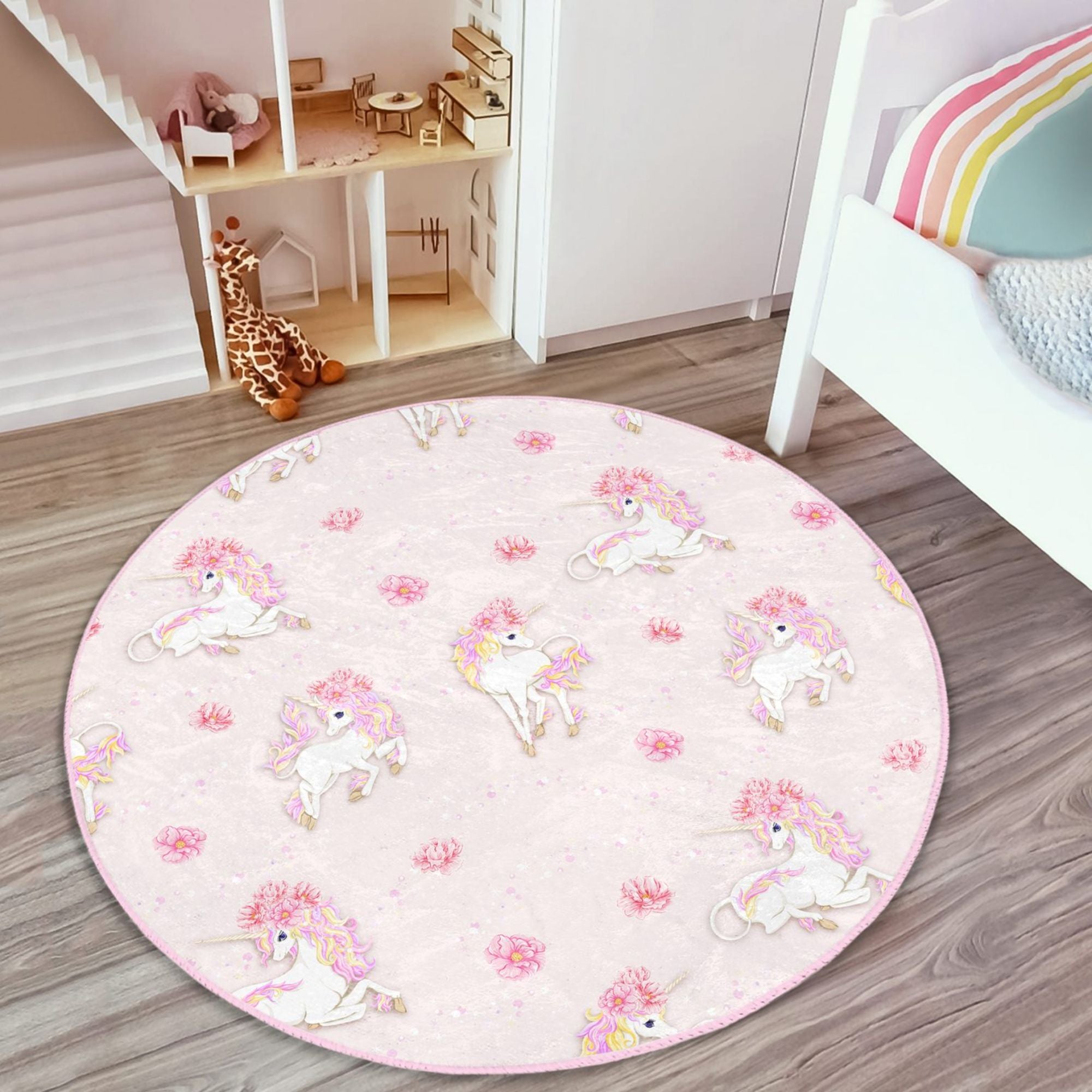 A vibrant pink rug featuring a whimsical unicorn pattern, perfect for a girl's room or nursery, made from soft and durable materials.