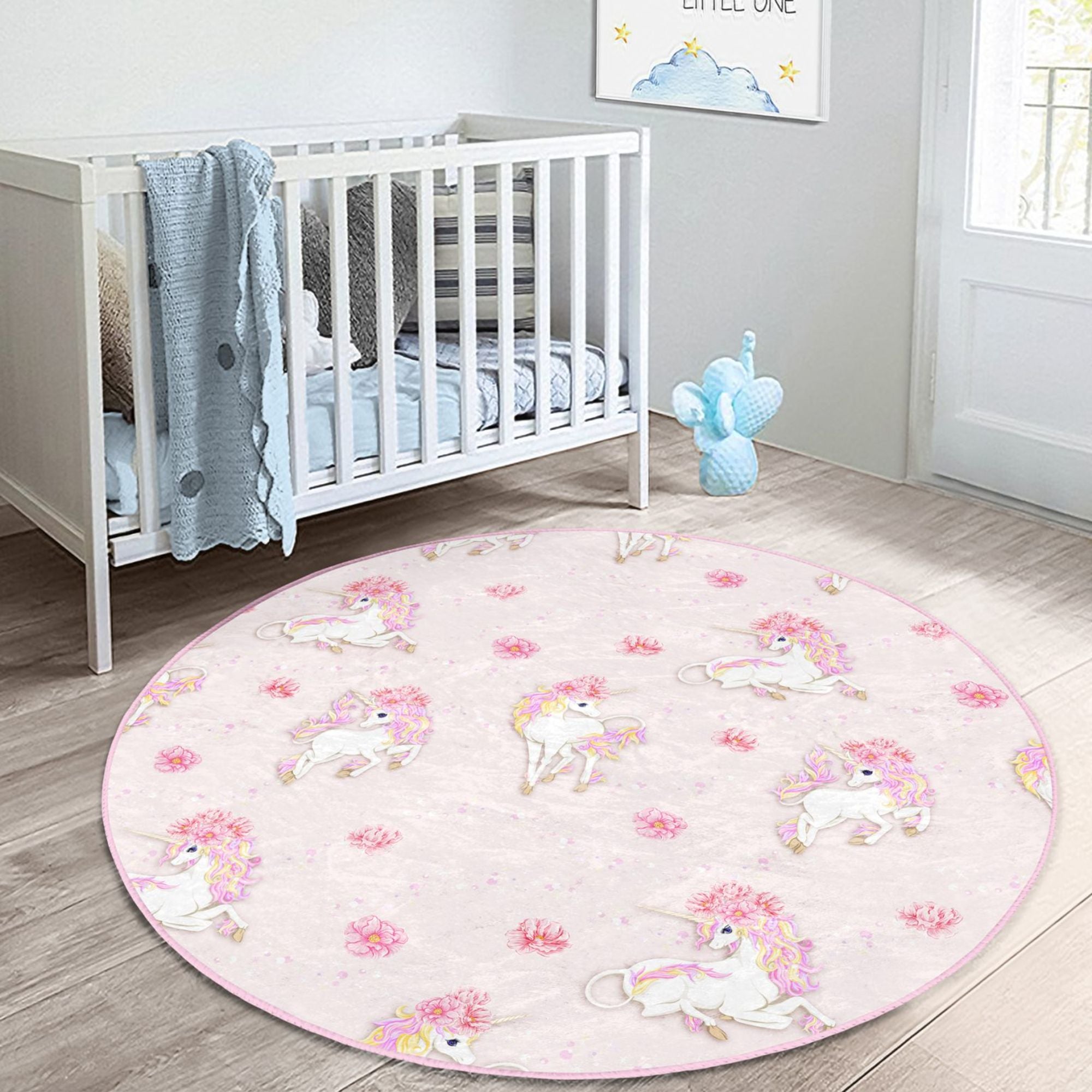 A vibrant pink rug featuring a whimsical unicorn pattern, perfect for a girl's room or nursery, made from soft and durable materials.