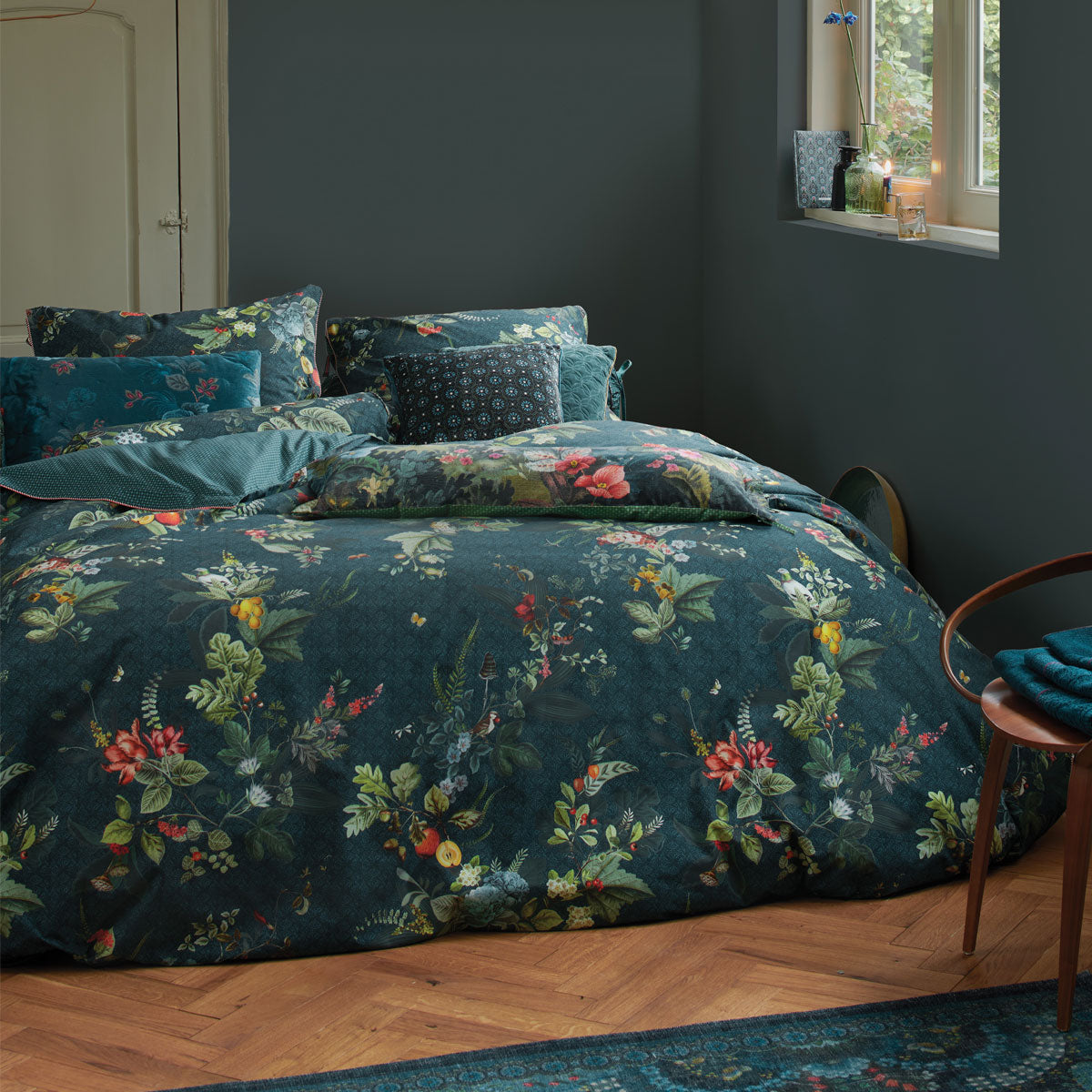 PIP Studio Fall in Leaf Dark Blue Cotton Quilt Cover Set featuring vibrant botanical designs with warm flowers and winter leaves.